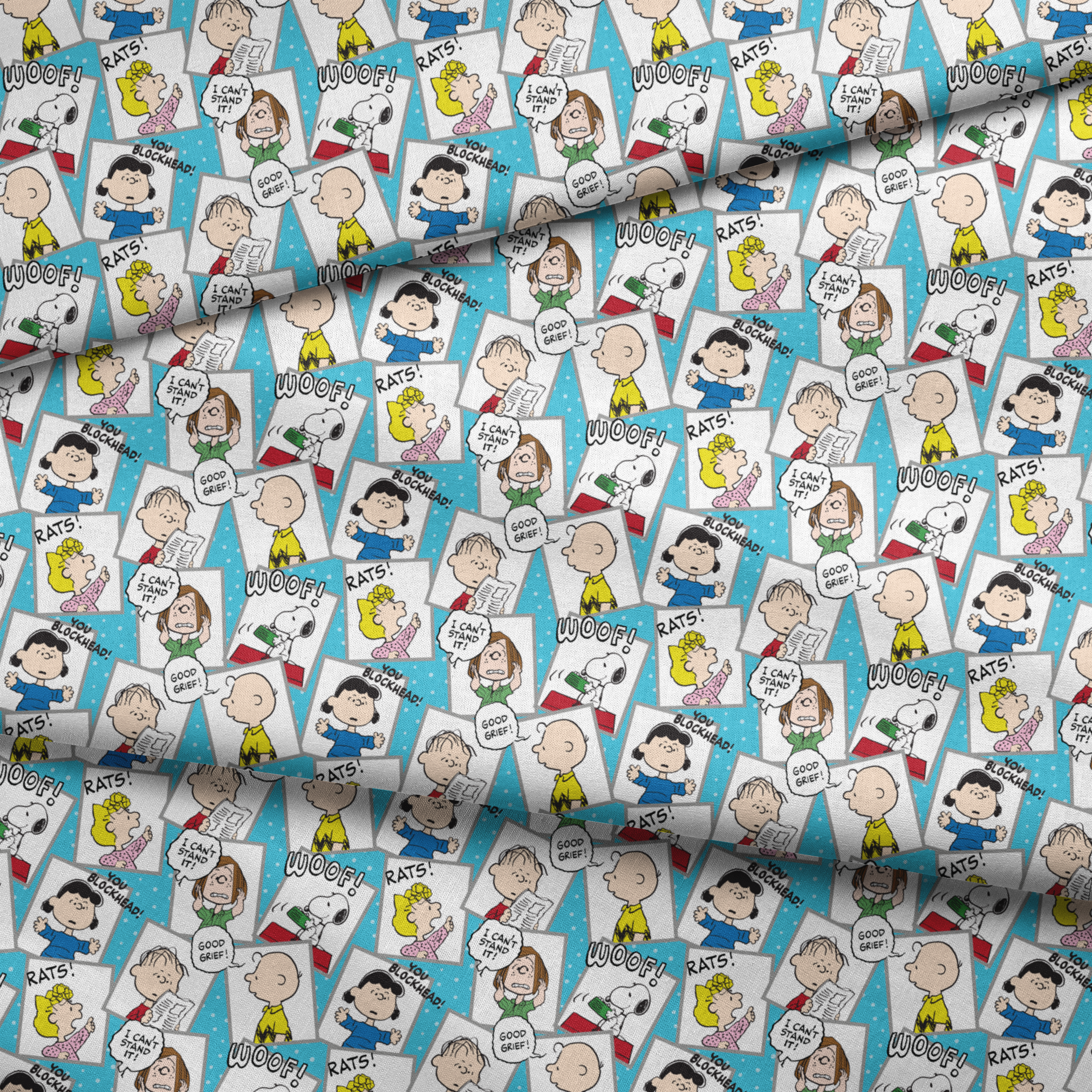 Peanuts comic characters in various expressions - Snoopy saying "WOOF!", speech bubbles with "RATS!", "I CAN'T STAND IT!", "YOU BLOCKHEAD!" and "GOOD GRIEF! fabric fold mockup