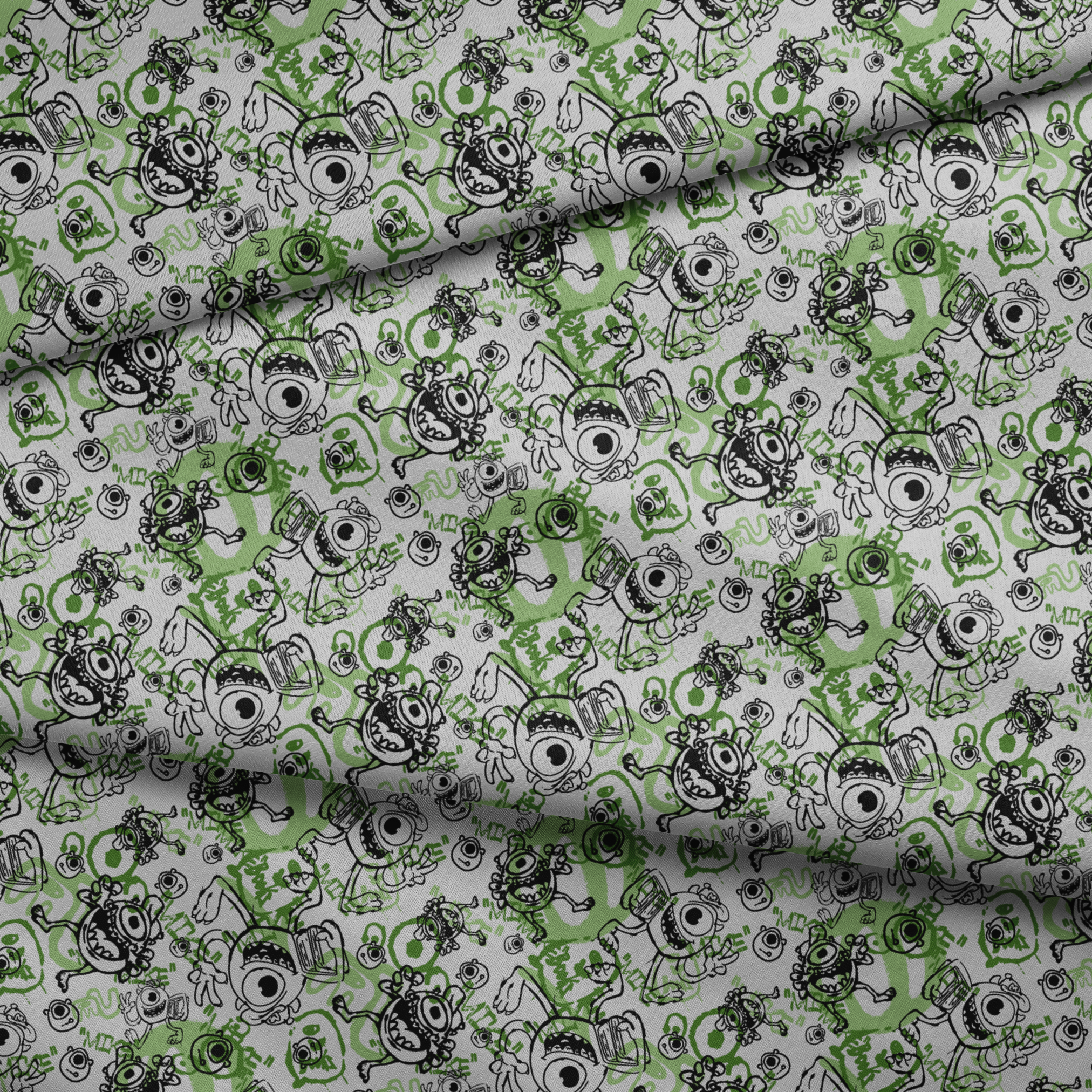 Cartoon monsters doodle pattern in black and green on white background with large eyes and silly expressions fabric fold mockup
