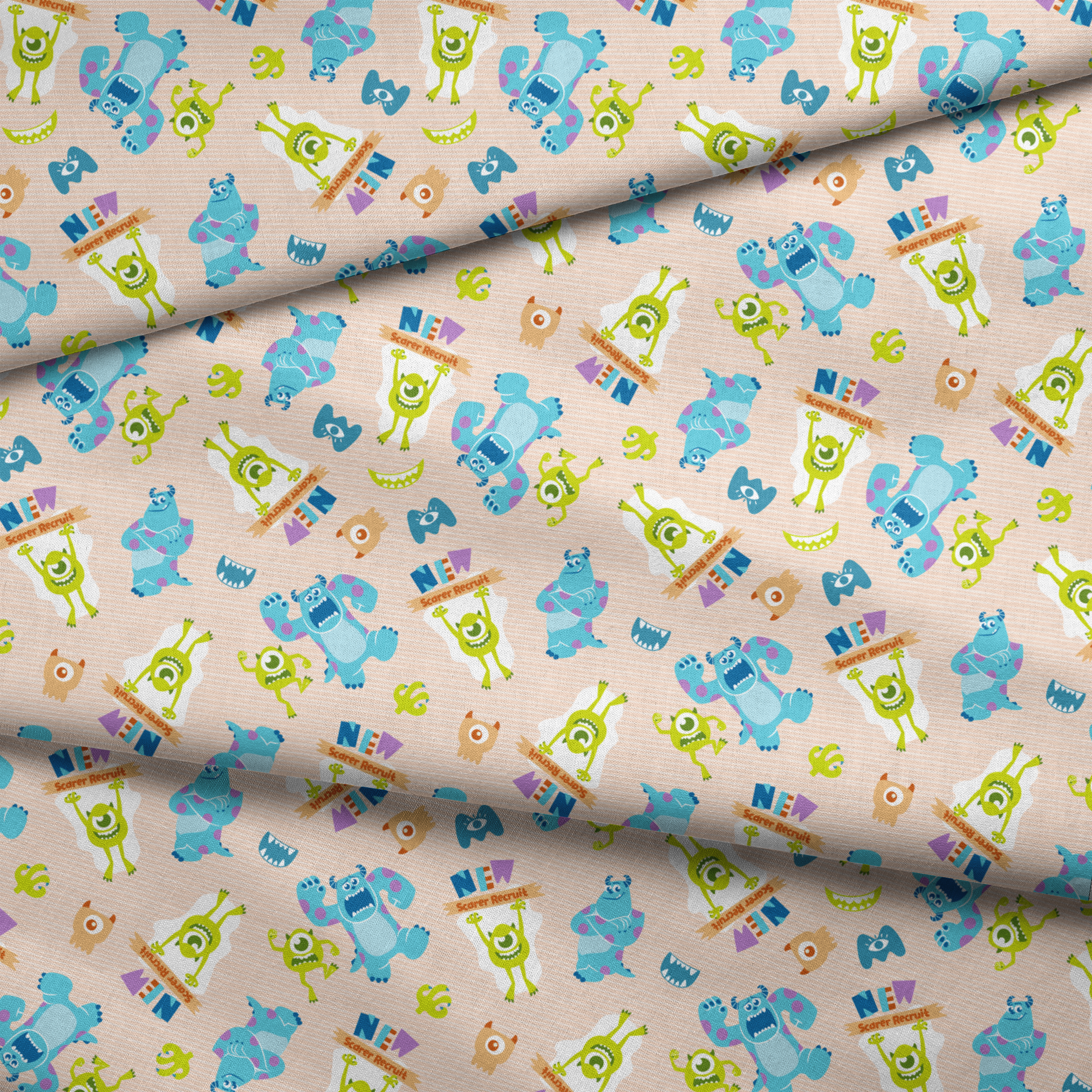 Colorful Monsters Inc pattern with Mike and Sully characters on peach background with scattered letters fabric fold mockup