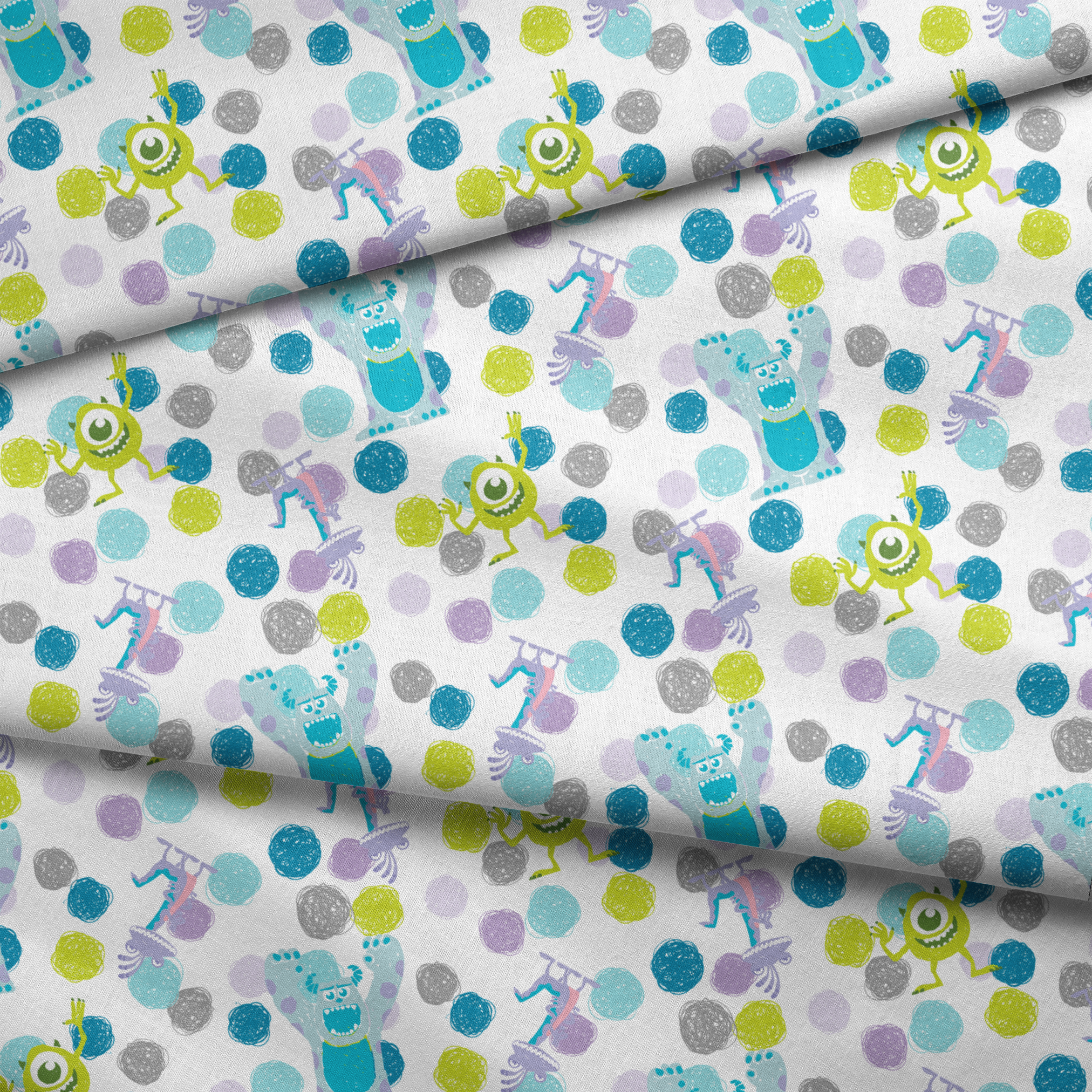 Colorful pattern featuring cartoon monsters with polka dots in blue, green, and purple on white background fabric fold mockup