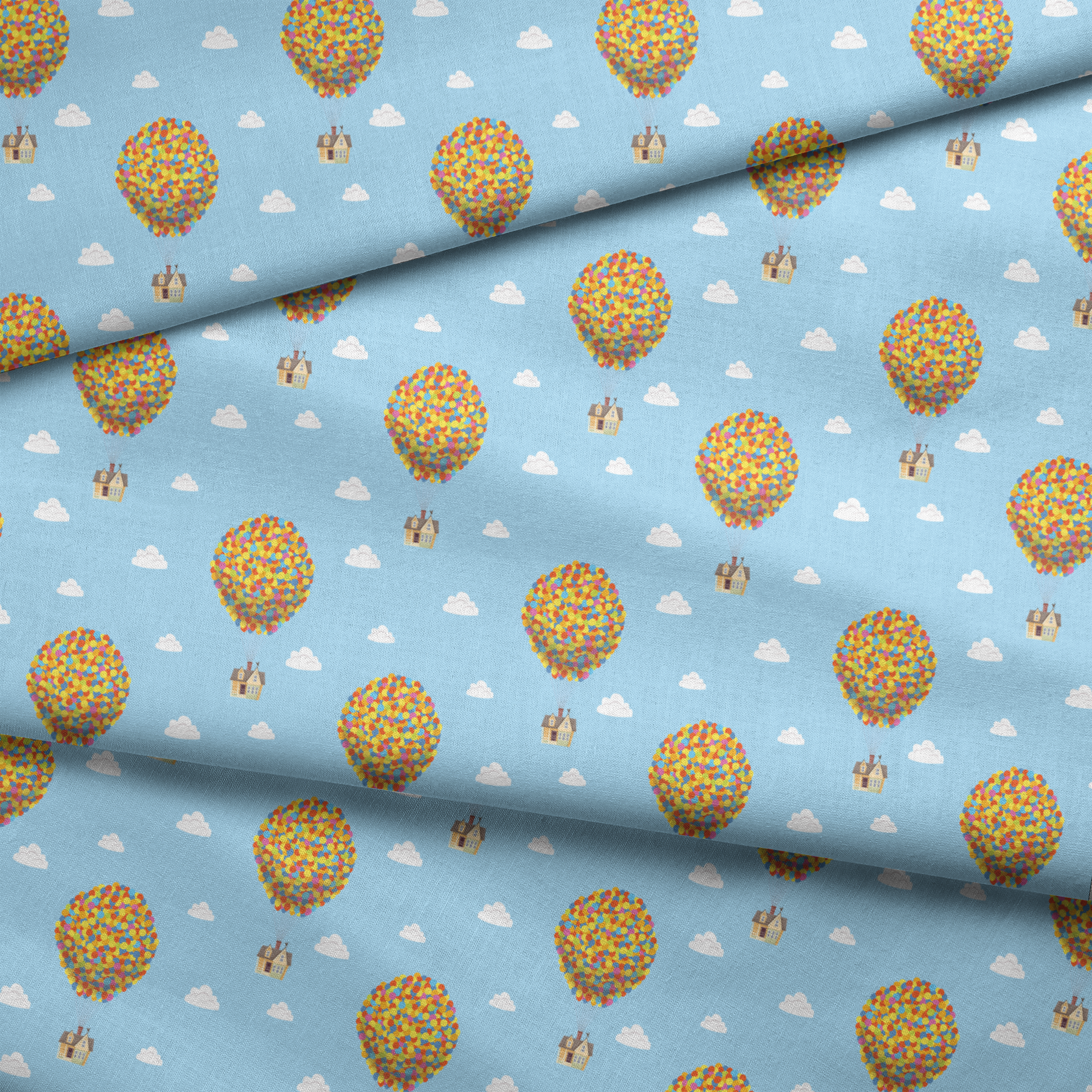Repeating Up pattern of houses lifted by colorful balloon clusters against a light blue sky with white clouds fabric fold mockup