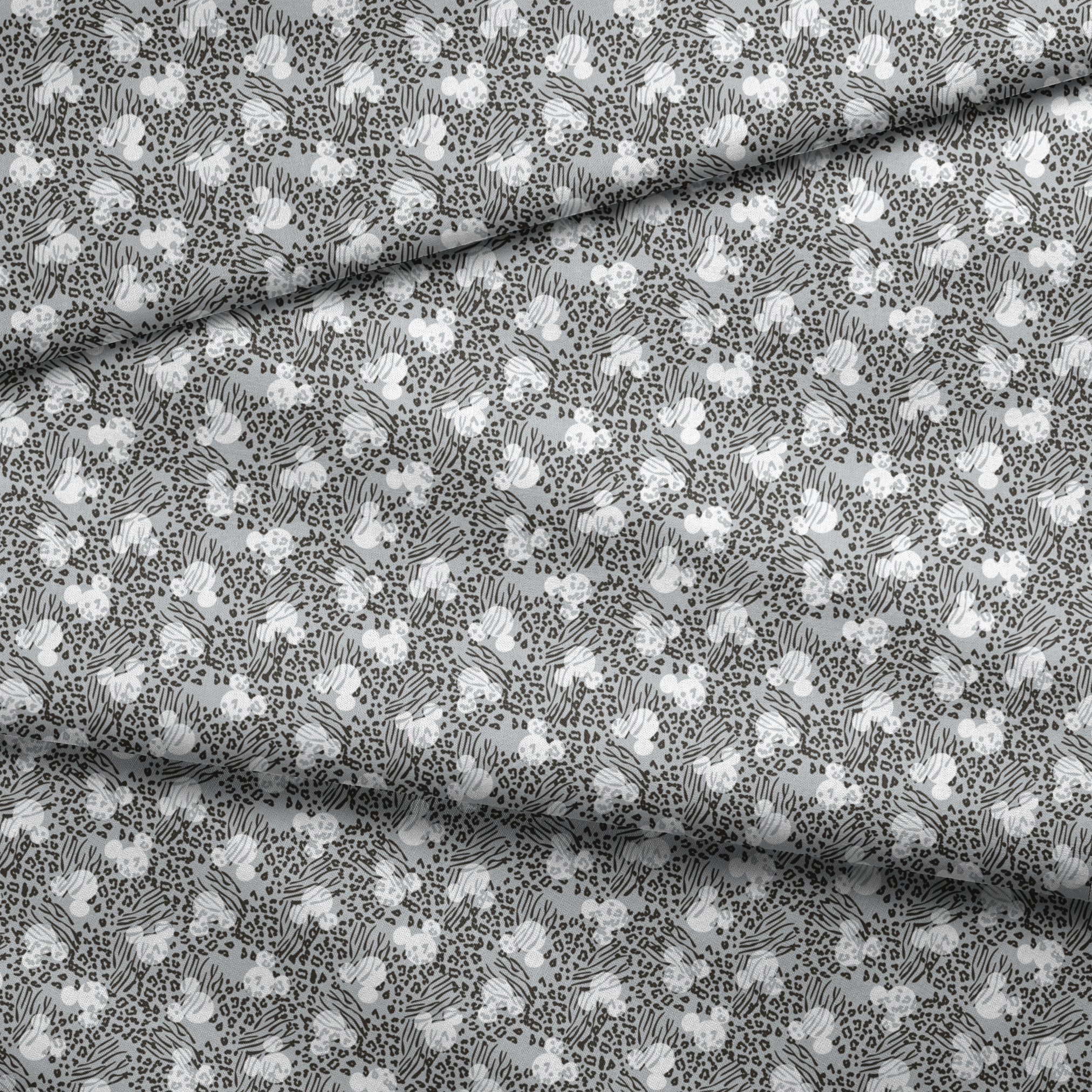 Animal print pattern with zebra stripes and leopard spots in black and white on gray background fabric fold mockup