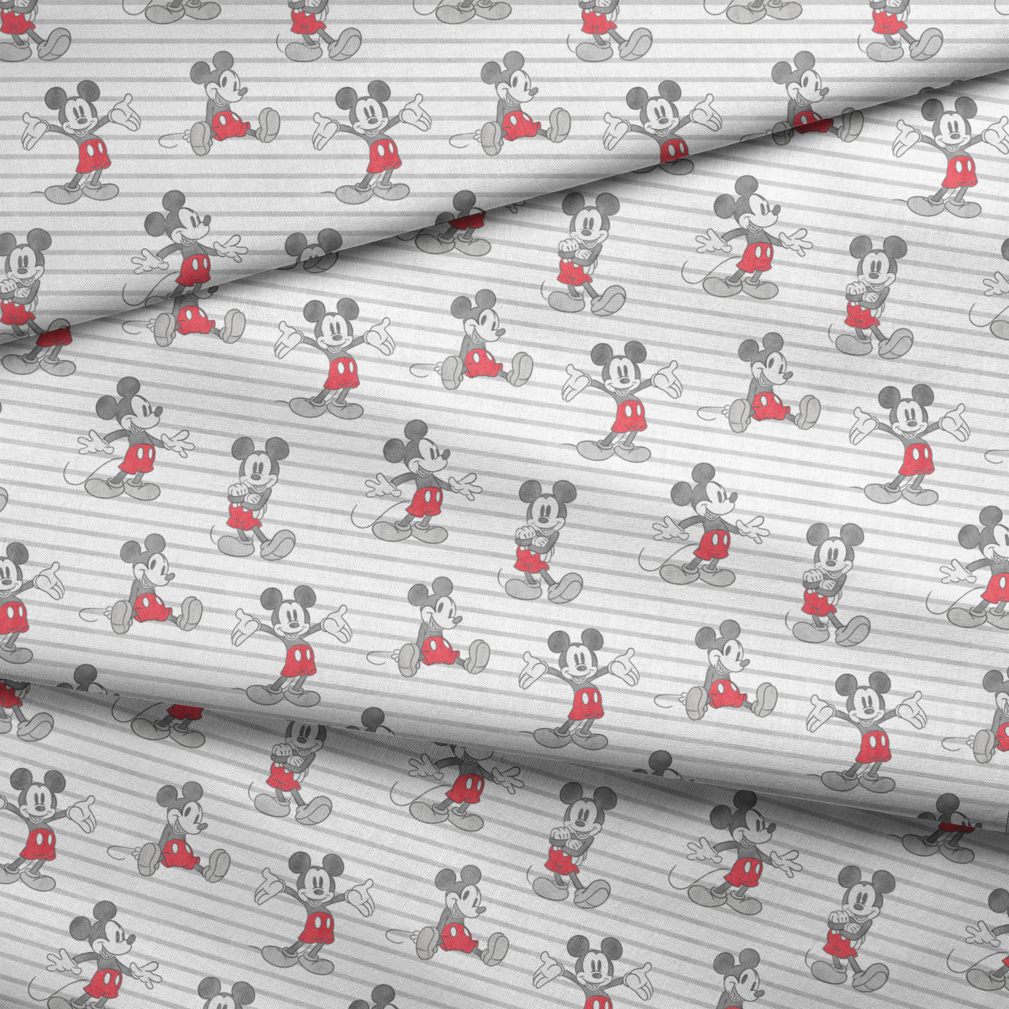Mickey Mouse cartoon characters in various poses on gray and white striped background fabric fold mockup