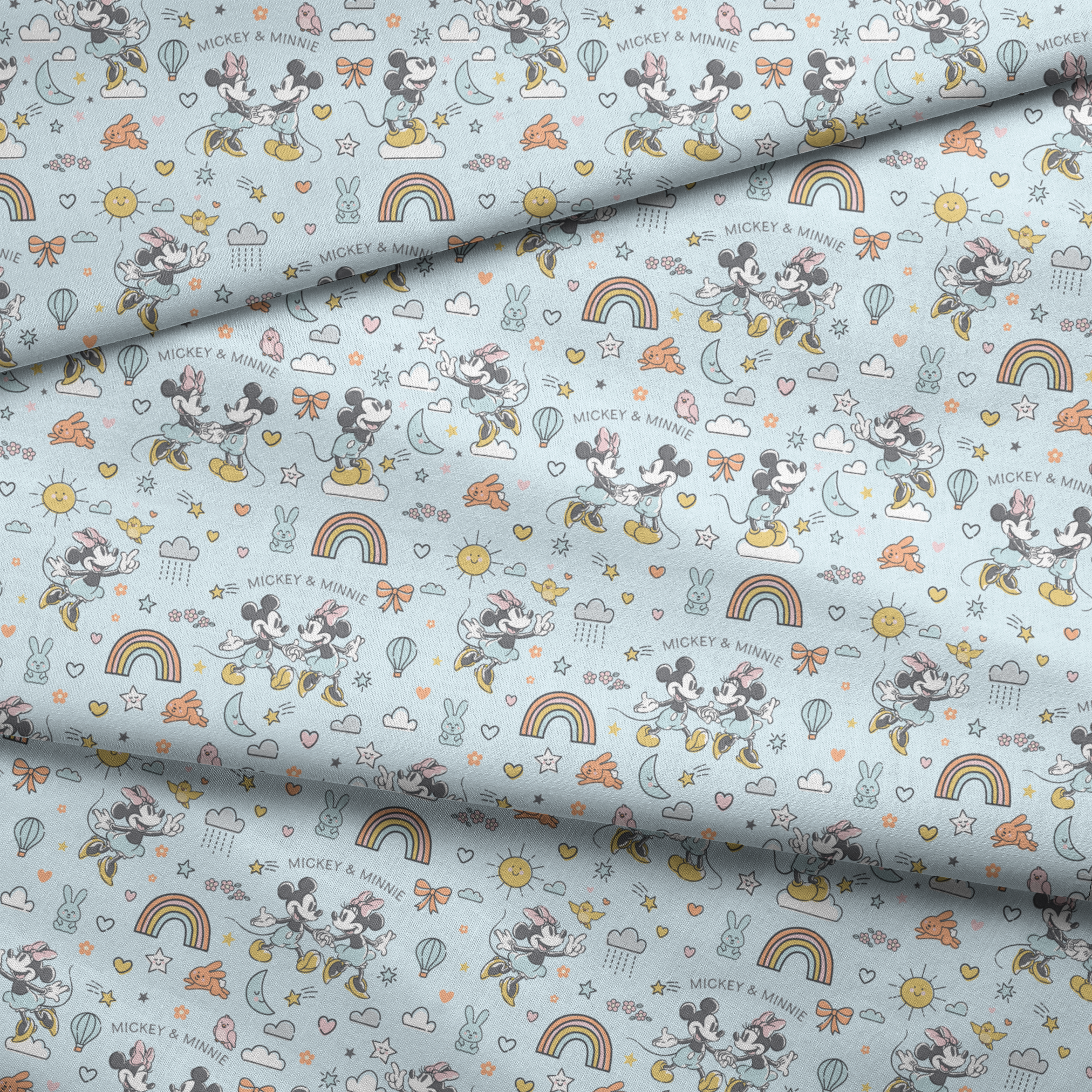 Playful Disney pattern with classic cartoon characters, rainbows, hearts, and whimsical elements on light blue background. fabric fold mockup