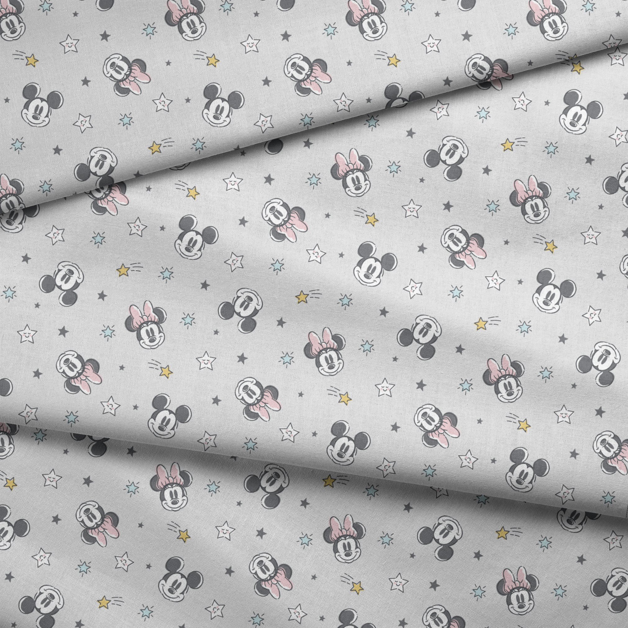 Mickey and Minnie Mouse pattern with stars on light gray background fabric fold mockup
