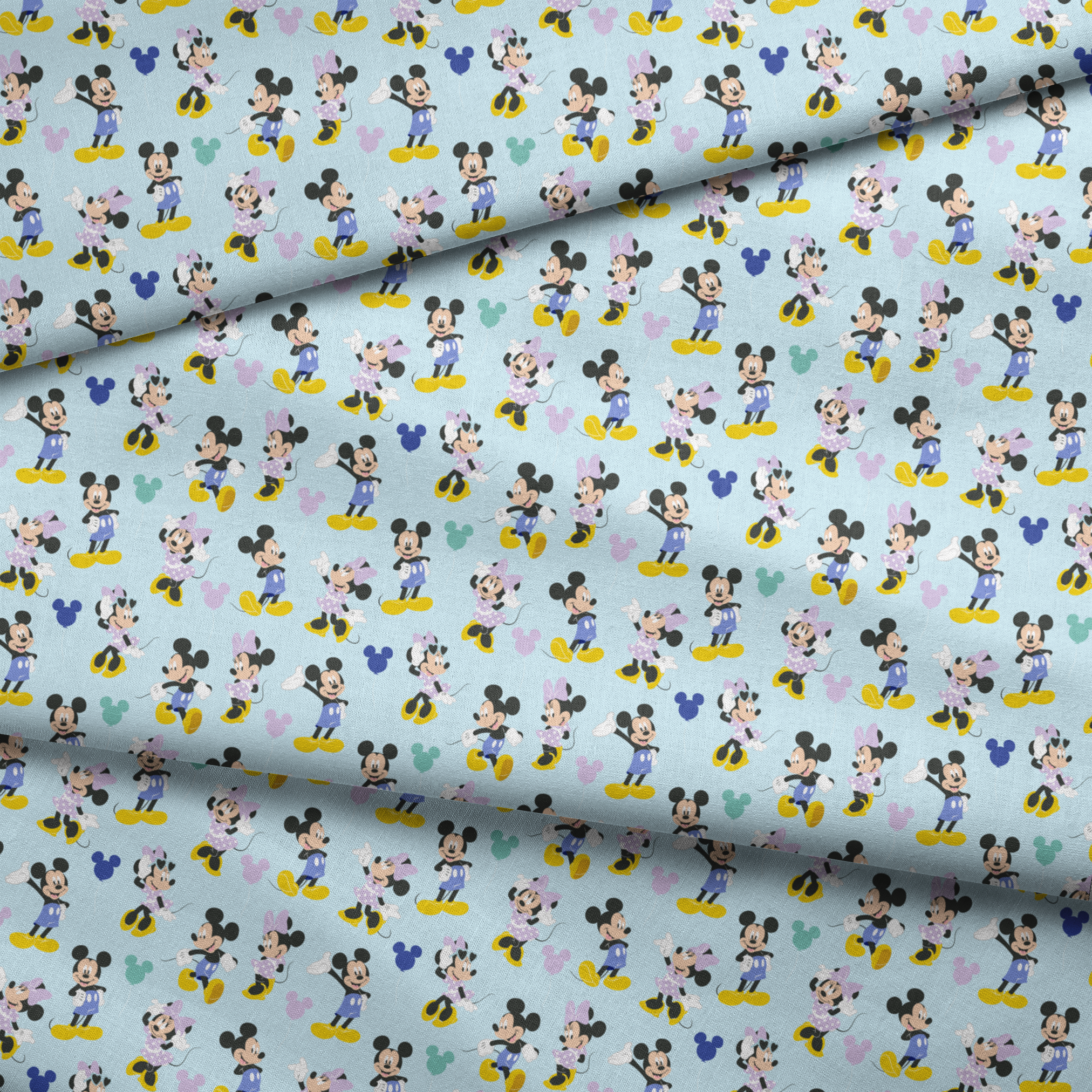 Pattern of Mickey and Minnie Mouse characters in various poses on light blue background fabric fold mockup