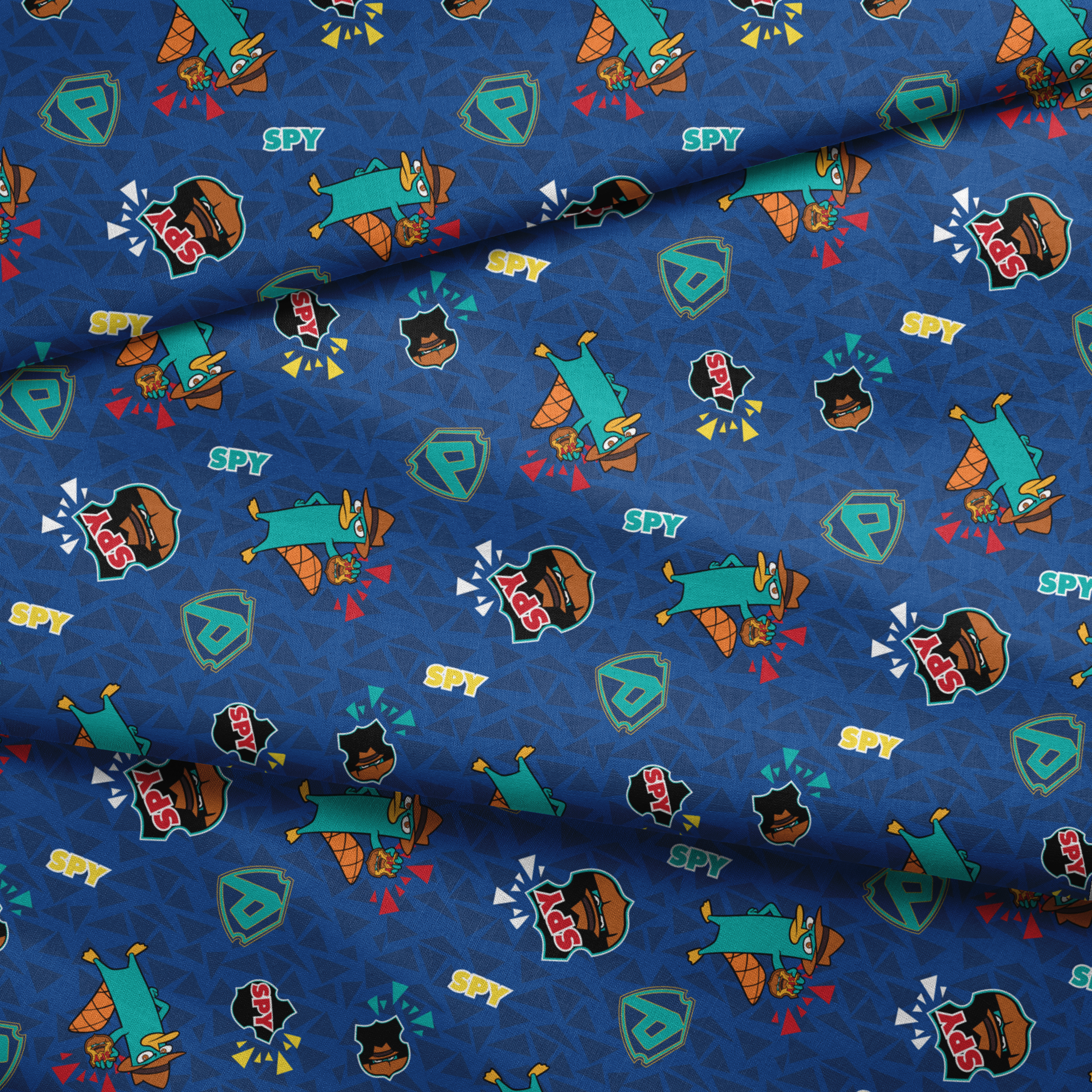 Colorful Perry the Platypus pattern with "SPY" text on blue geometric background fabric fold mockup