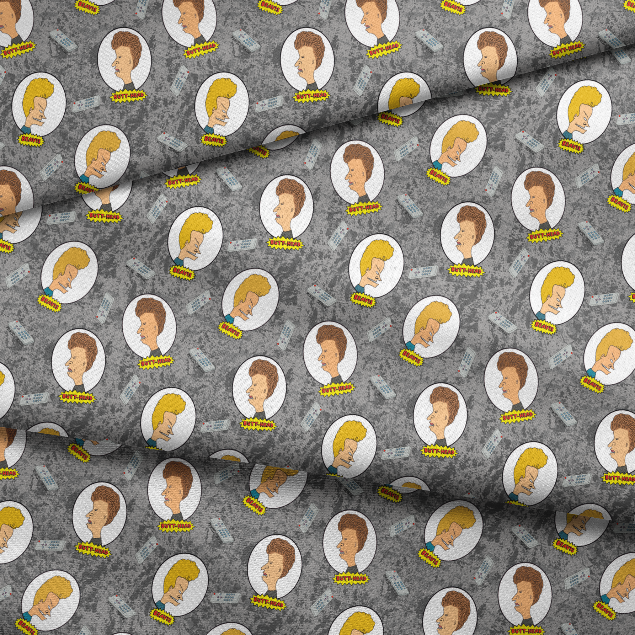 Cartoon pattern with blond and brown-haired animated characters in circular frames against a gray background with comic-style text bubbles. fabric fold mockup