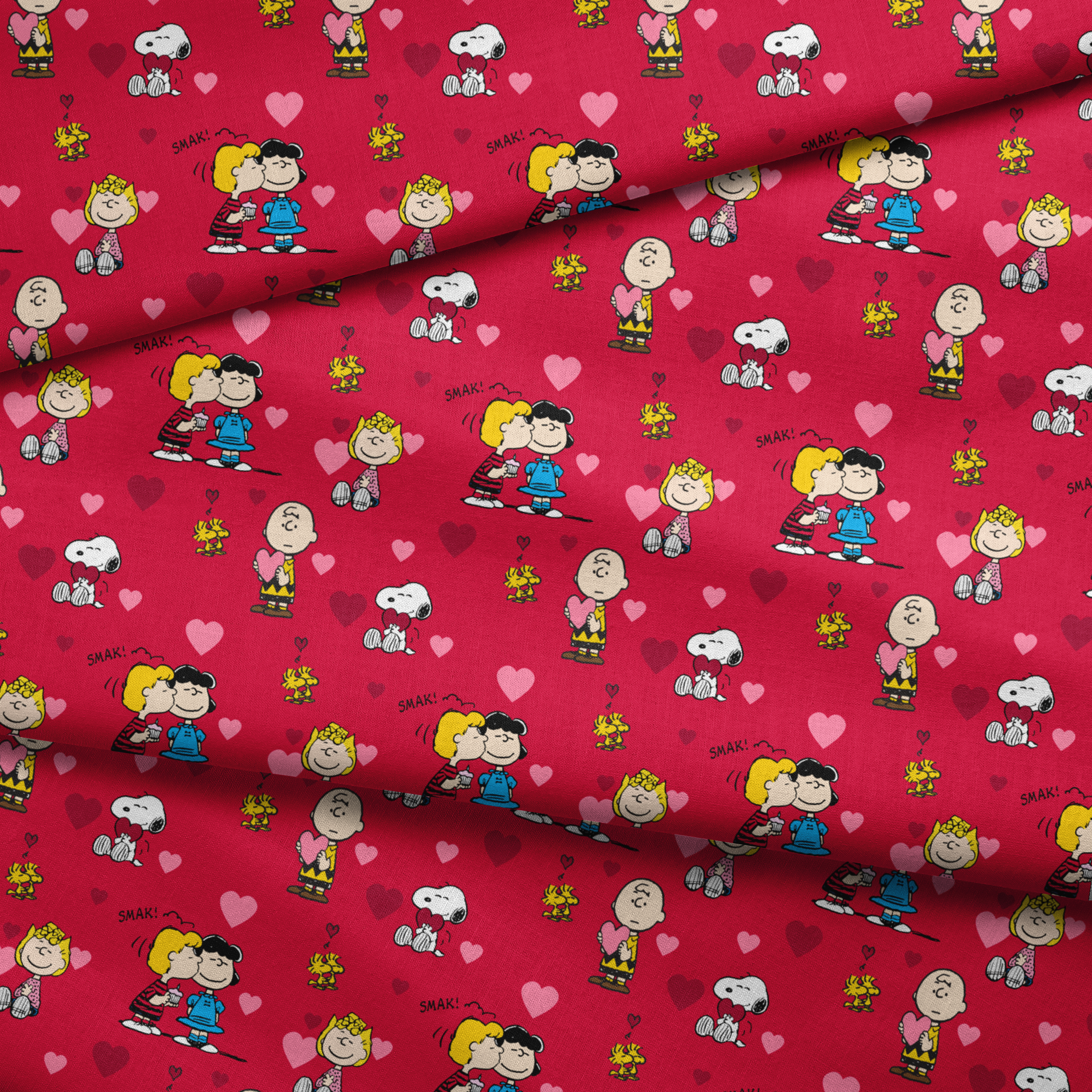 Peanuts characters on red background with hearts; Snoopy, Woodstock, and others in Valentine's theme fabric fold mockup