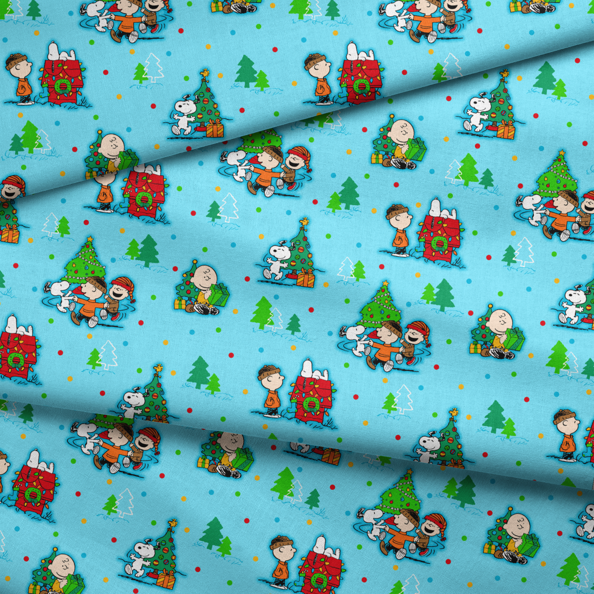 Peanuts Christmas pattern with Snoopy, Charlie Brown, and friends decorating trees on light blue background fabric fold mockup