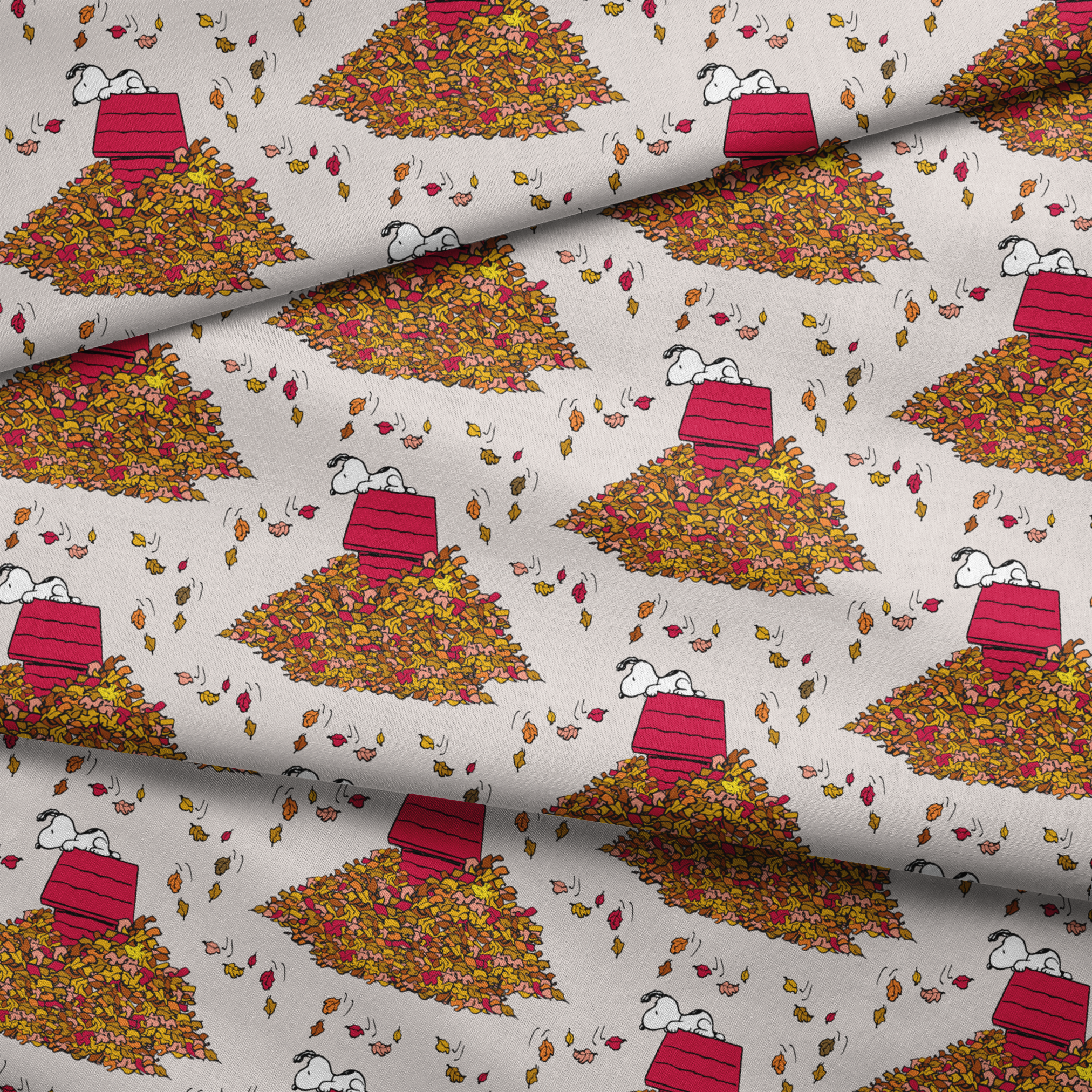 Snoopy and red doghouse on colorful autumn leaf piles with falling leaves pattern on beige background fabric fold mockup
