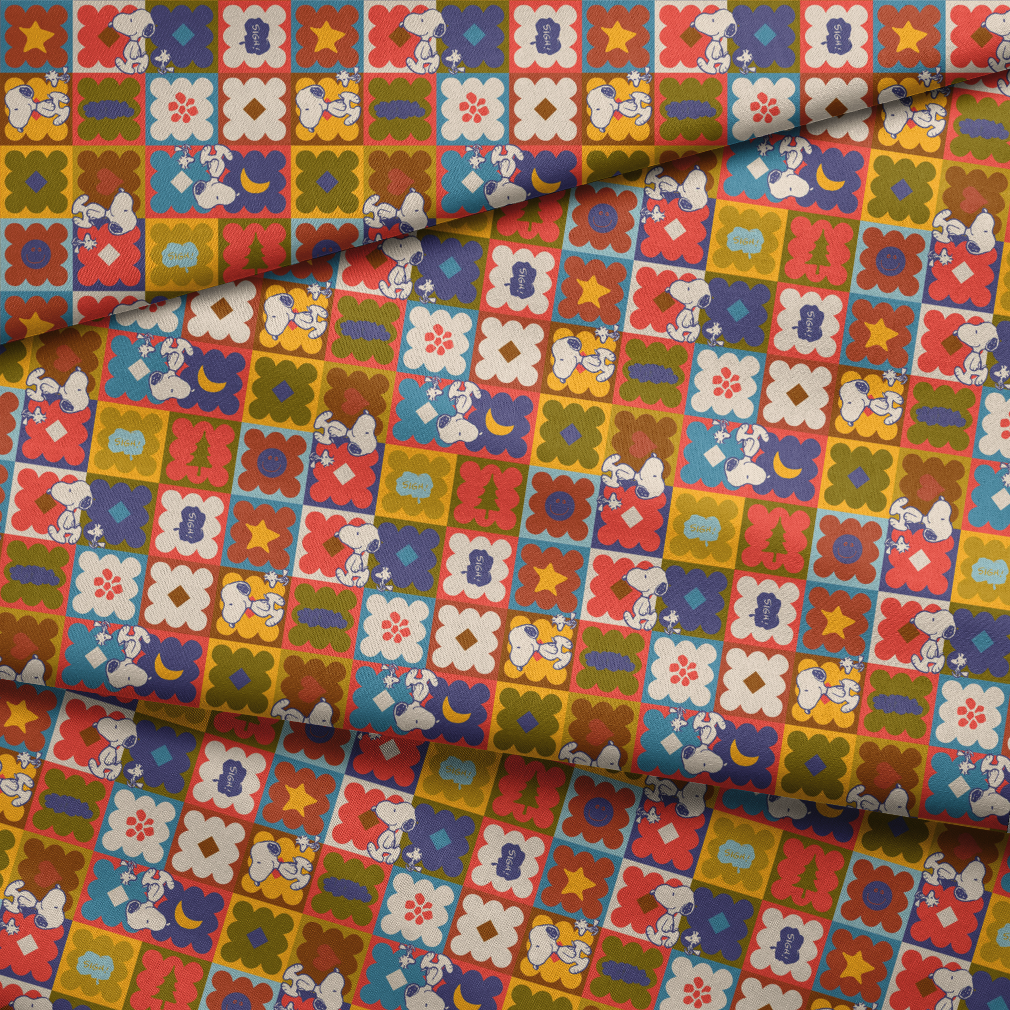 Colorful patchwork pattern featuring Snoopy characters in various squares with flowers, geometric shapes, and decorative elements fabric fold mockup