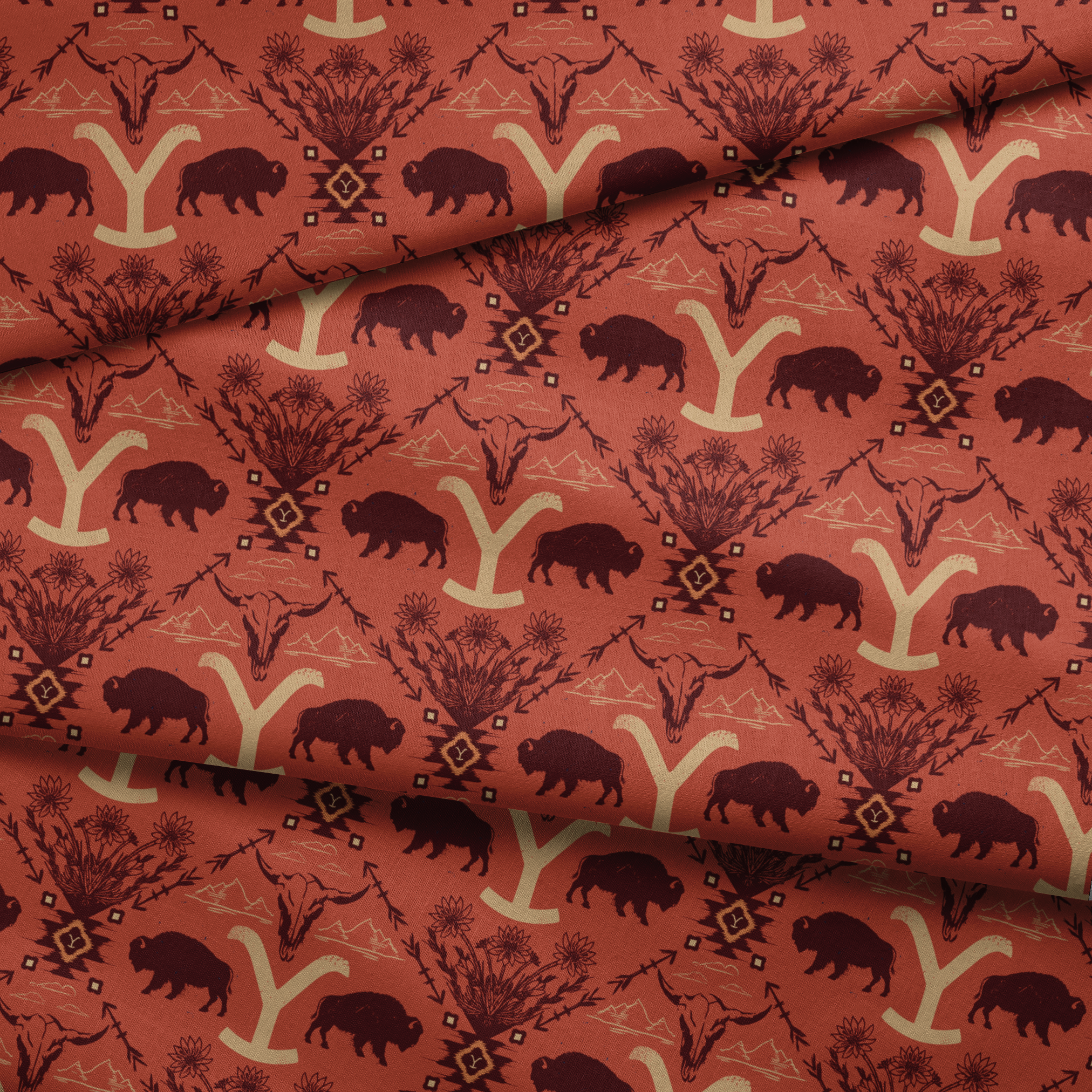 Terracotta and burgundy Yellowstone design with buffalo, skulls, wildflowers, and Western motifs. fabric fold mockup