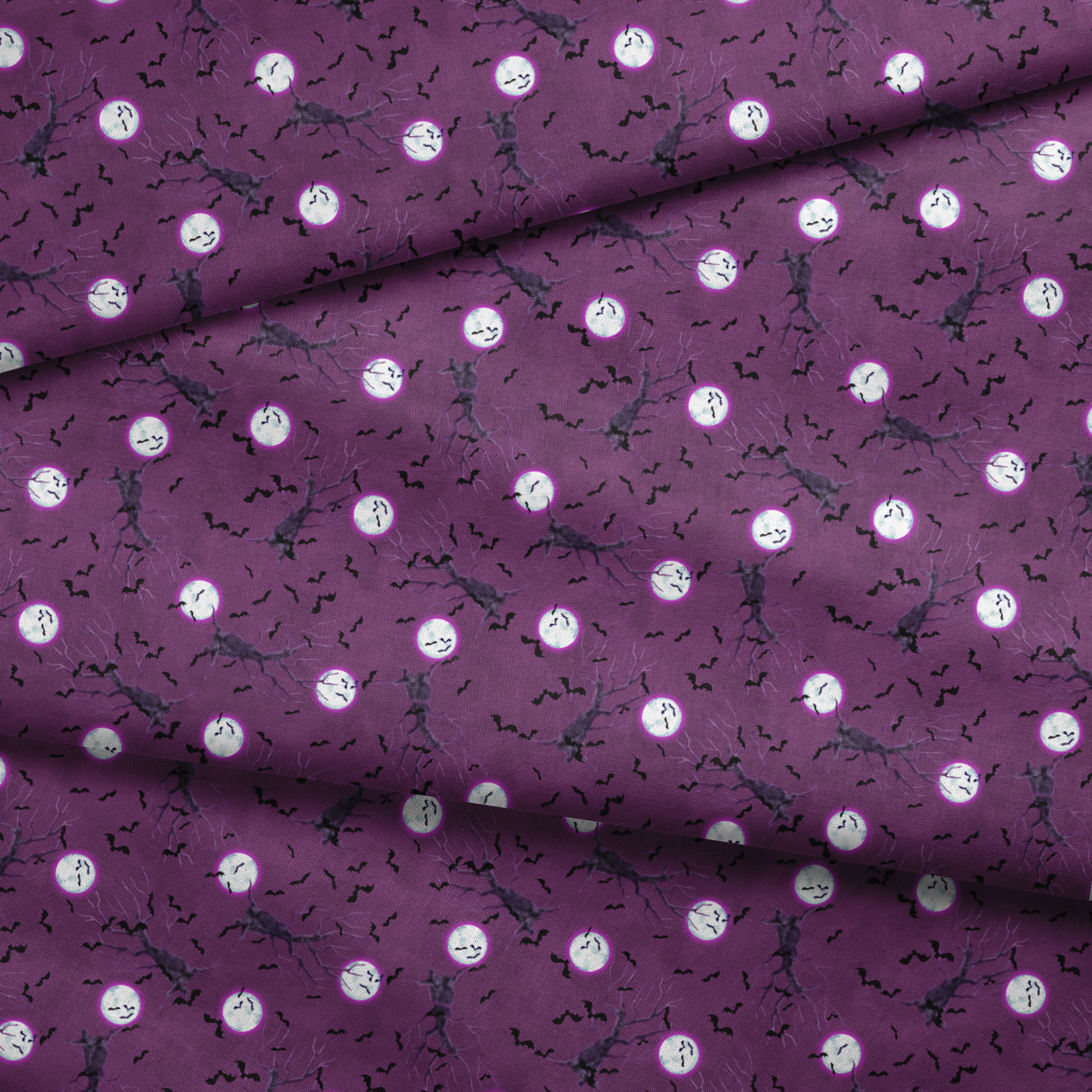 Halloween fabric design with spooky trees, bats, and glowing full moons on a purple background, illustrated by Nicole Tamarin. fabric fold mockup