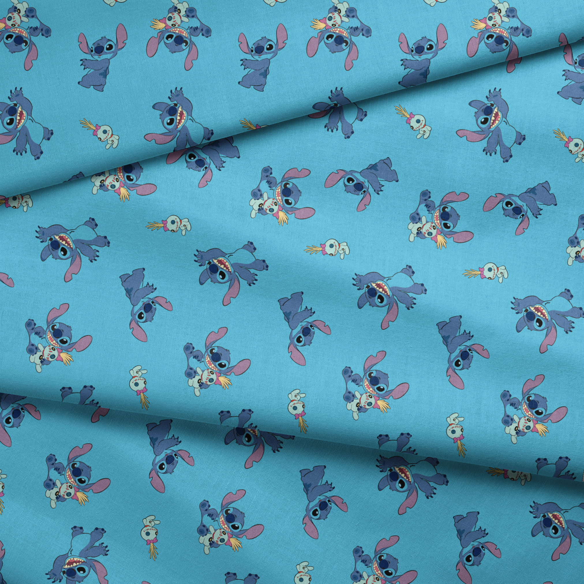 Disney’s Stitch and Scrump in various playful poses scattered across a light blue background with small tropical flowers. fabric fold mockup