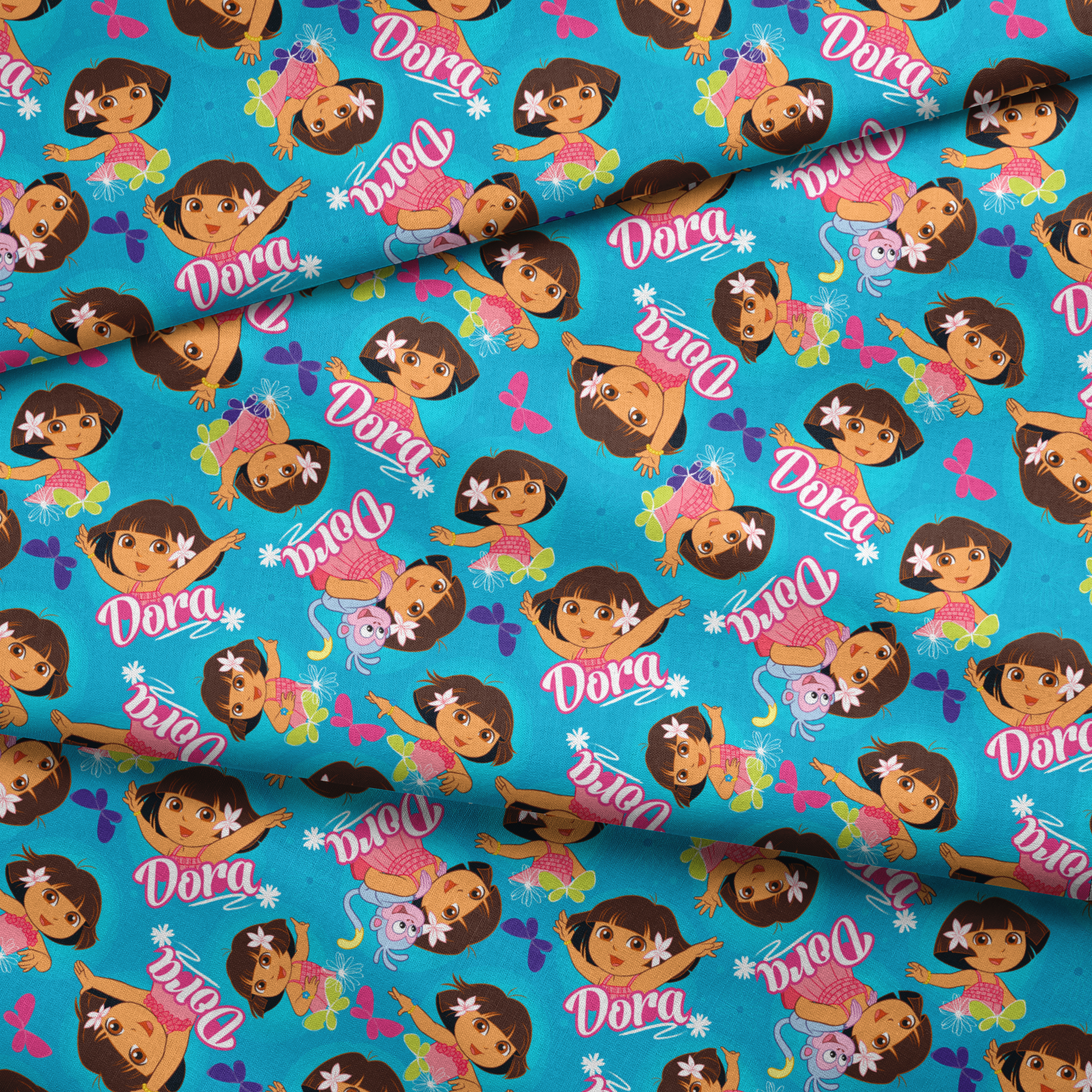 Bright blue pattern with cartoon character Dora, flowers, and "Dora" text repeated throughout fabric fold mockup
