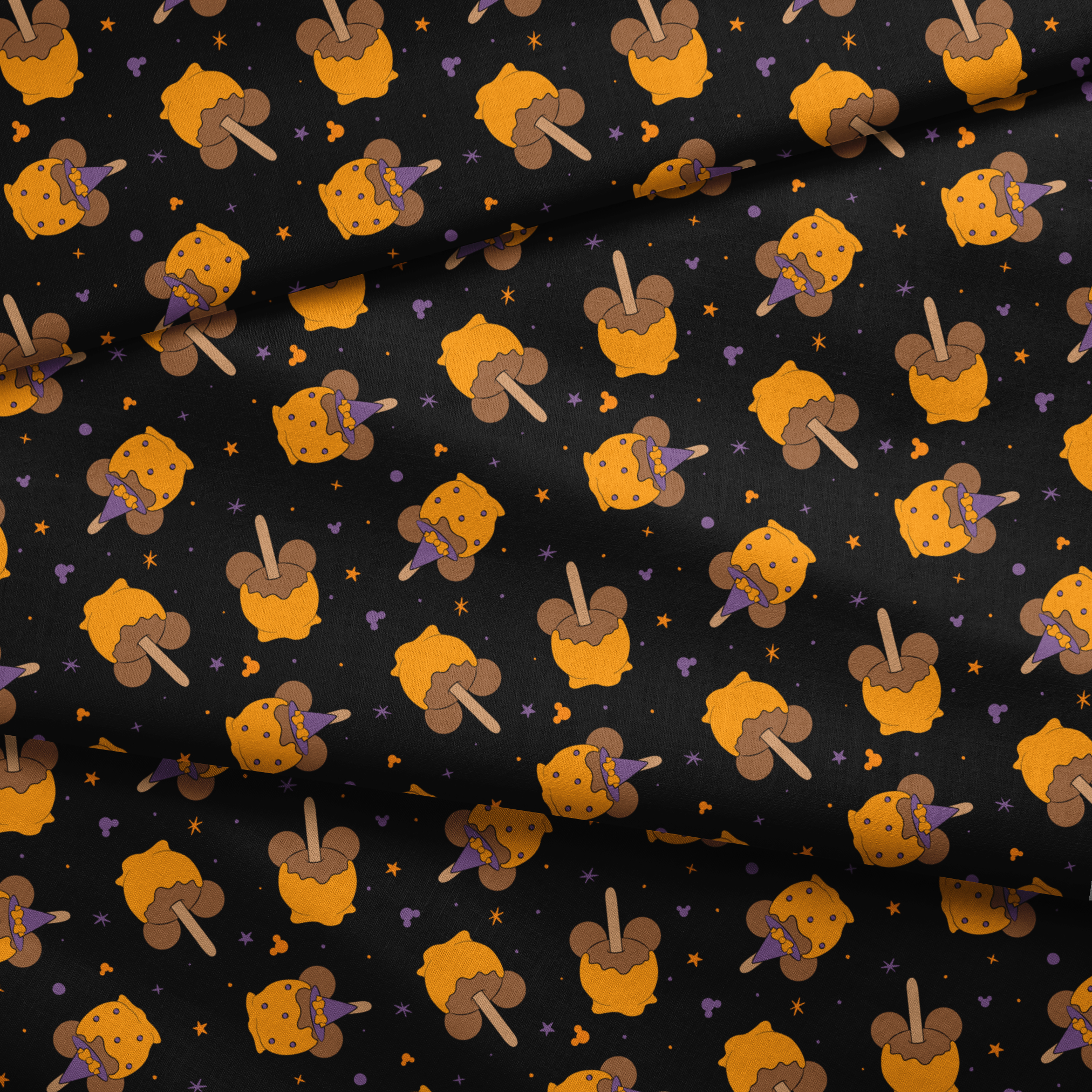 Disney-inspired caramel apples and candy apples floating in a space-like black background with purple stars. fabric fold mockup