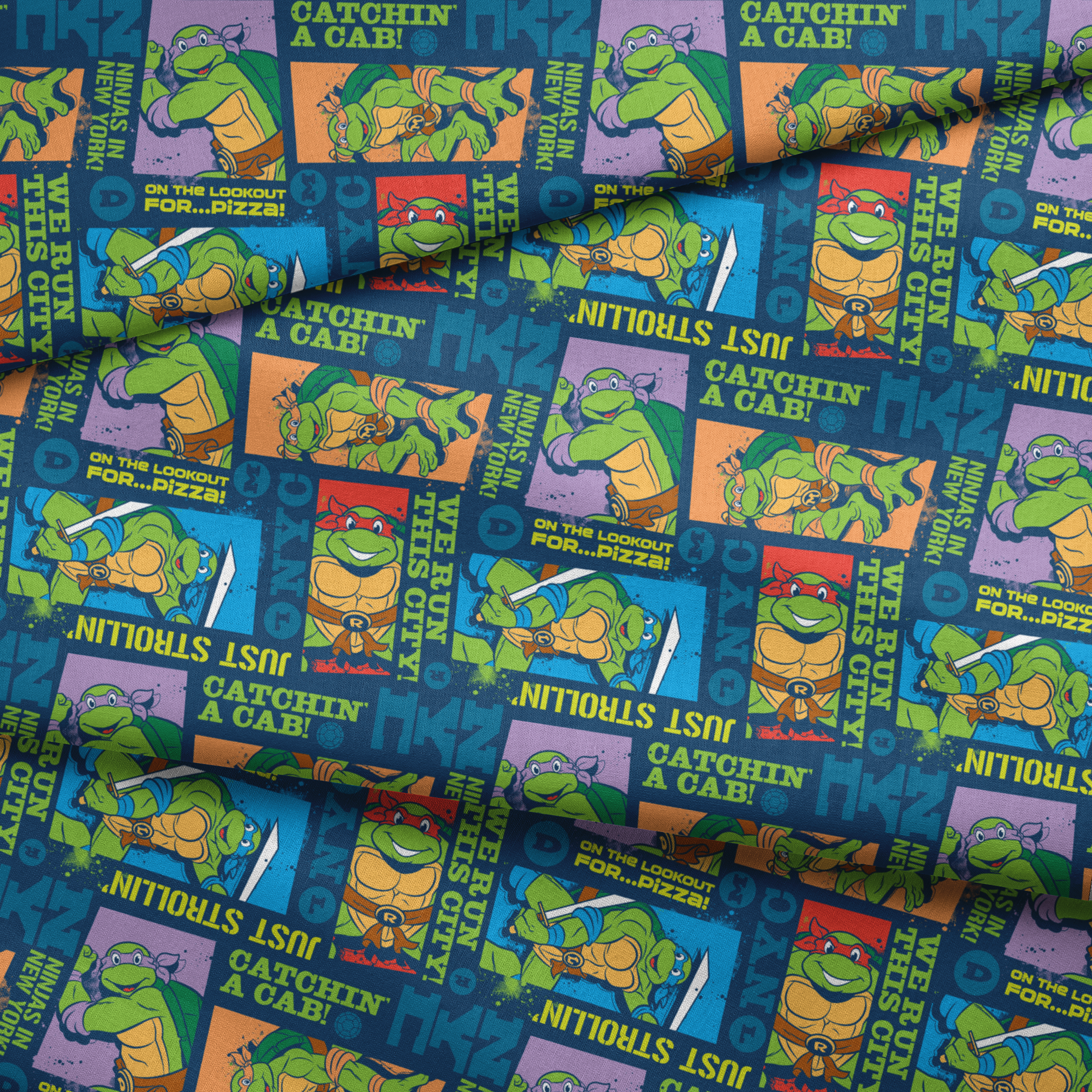 Teenage Mutant Ninja Turtles comic-style panels with characters in action poses and phrases like "Catchin' a Cab!" and "On the Lookout for Pizza! fabric fold mockup
