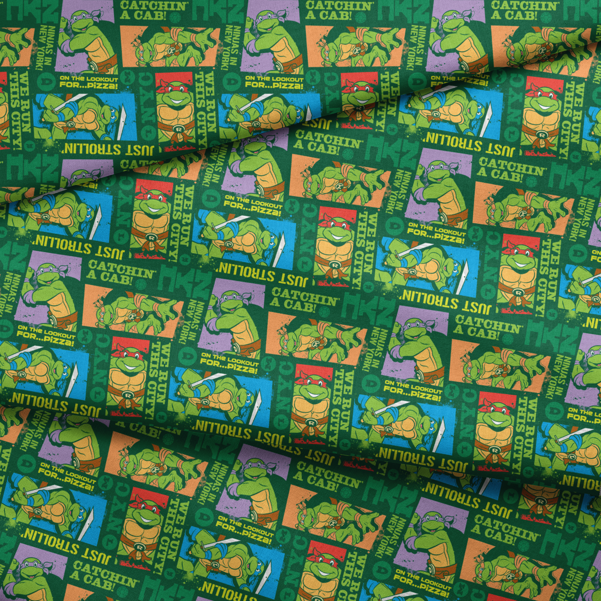 Teenage Mutant Ninja Turtles comic-style panels with phrases like "Catchin' a cab!" and "On the lookout for pizza!" on green background fabric fold mockup