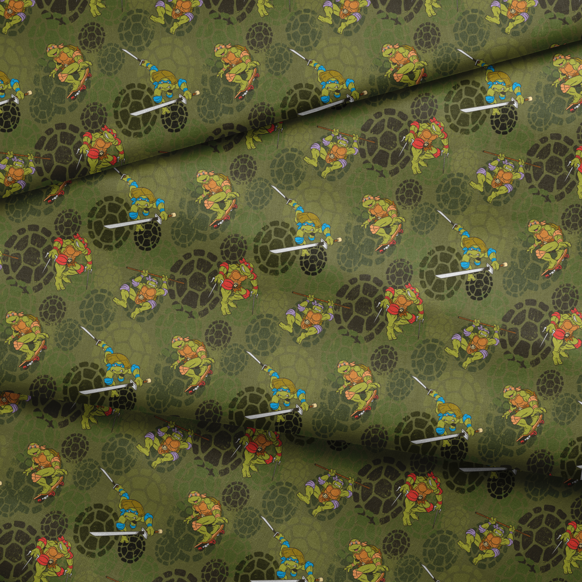 Teenage Mutant Ninja Turtles characters in action poses on green background with turtle shell patterns fabric fold mockup