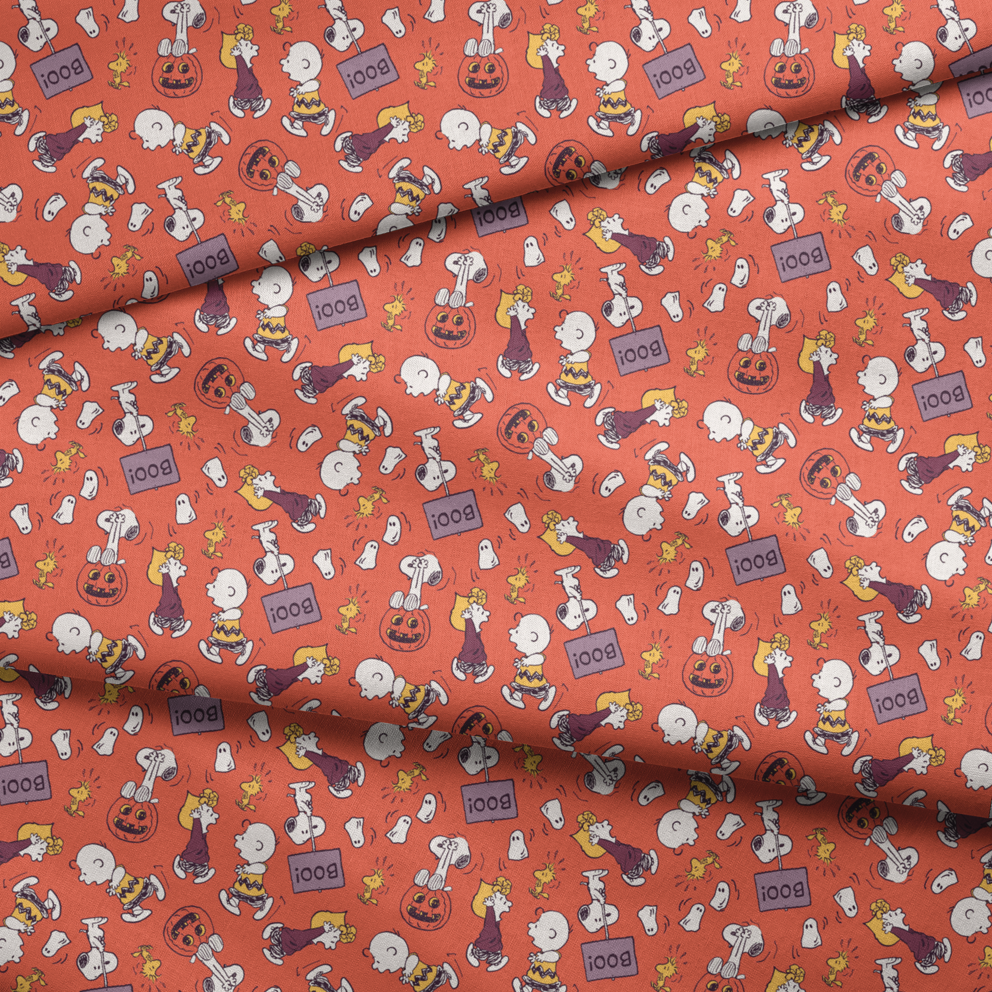 Snoopy and Woodstock Halloween pattern on orange background with pumpkins, ghosts, and "boo" text fabric fold mockup