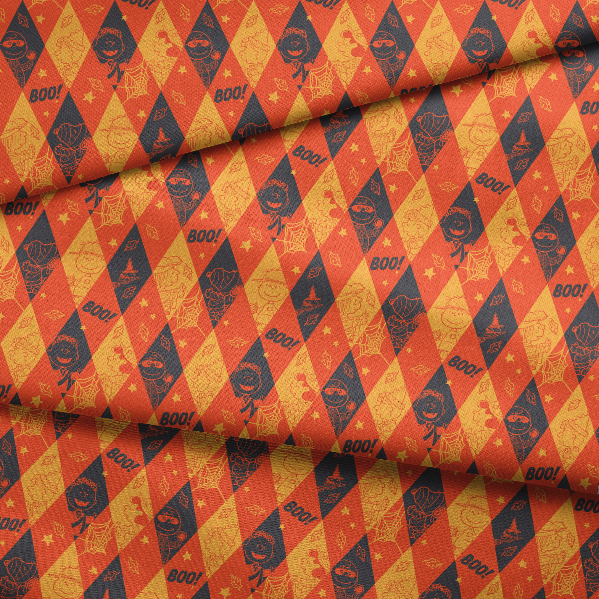Peanuts Halloween pattern with diamond shapes in orange, yellow, and black featuring Peanuts characters in costumes, webs, "BOO!" text, and seasonal decorations fabric fold mockup