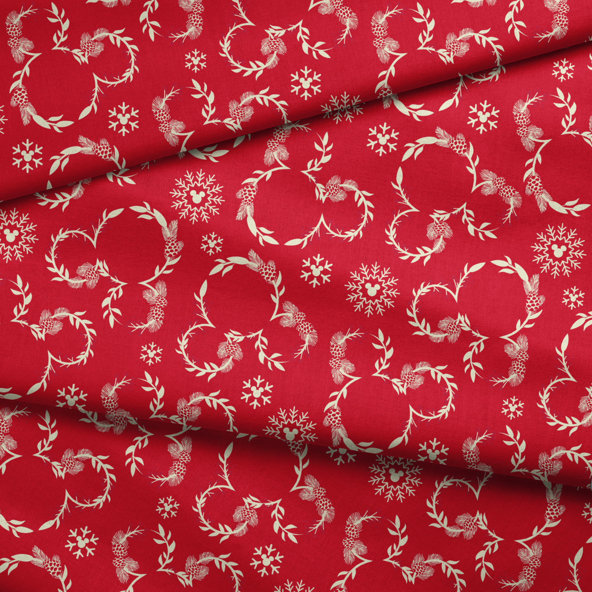 Festive red background with white floral wreaths, pine cones, and snowflake patterns fabric fold mockup