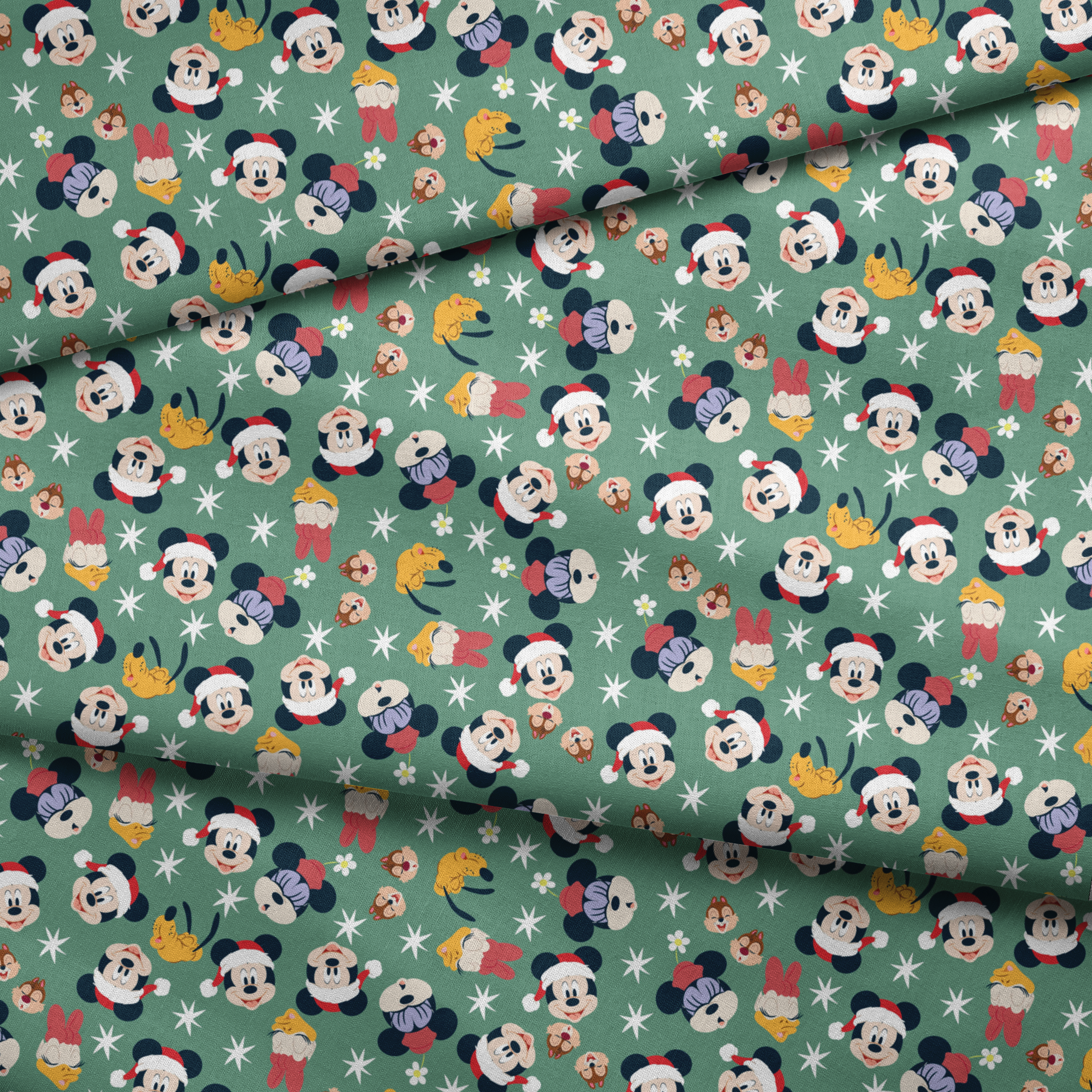 Mickey Mouse holiday pattern with characters wearing Santa hats on green background with stars and ornaments fabric fold mockup