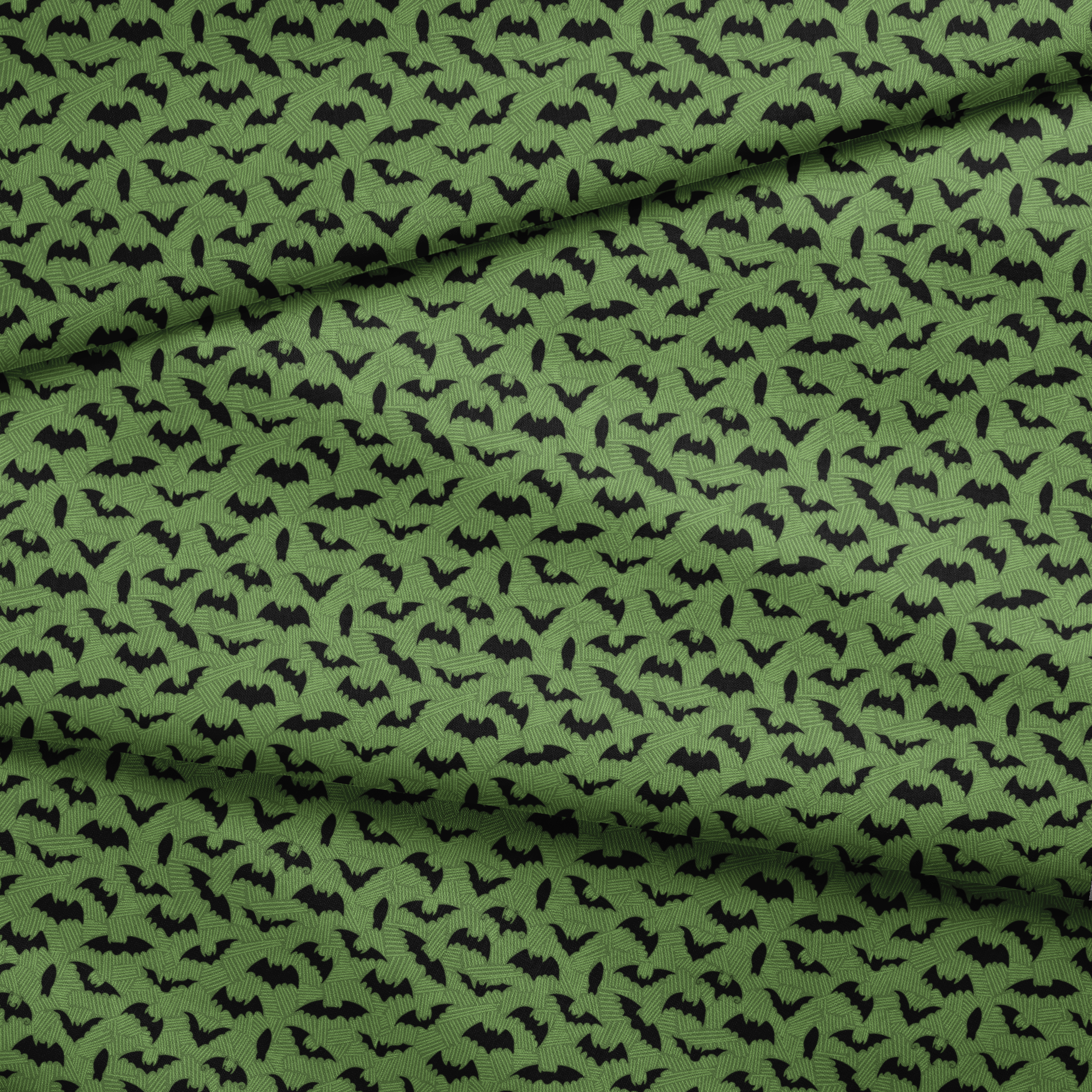 Black bat silhouettes scattered across a green textured background with zigzag pattern fabric fold mockup