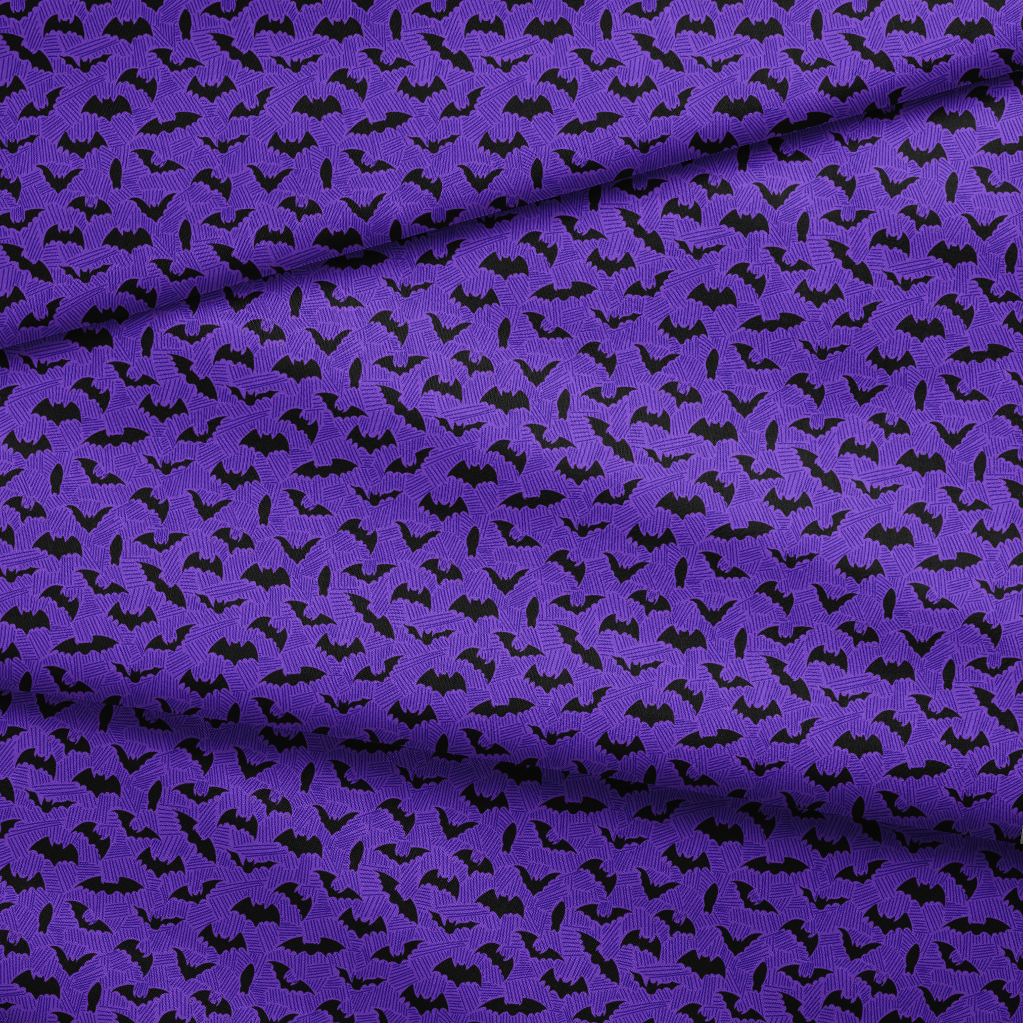 Black bat silhouettes scattered over purple zigzag background, Halloween-themed pattern fabric fold mockup