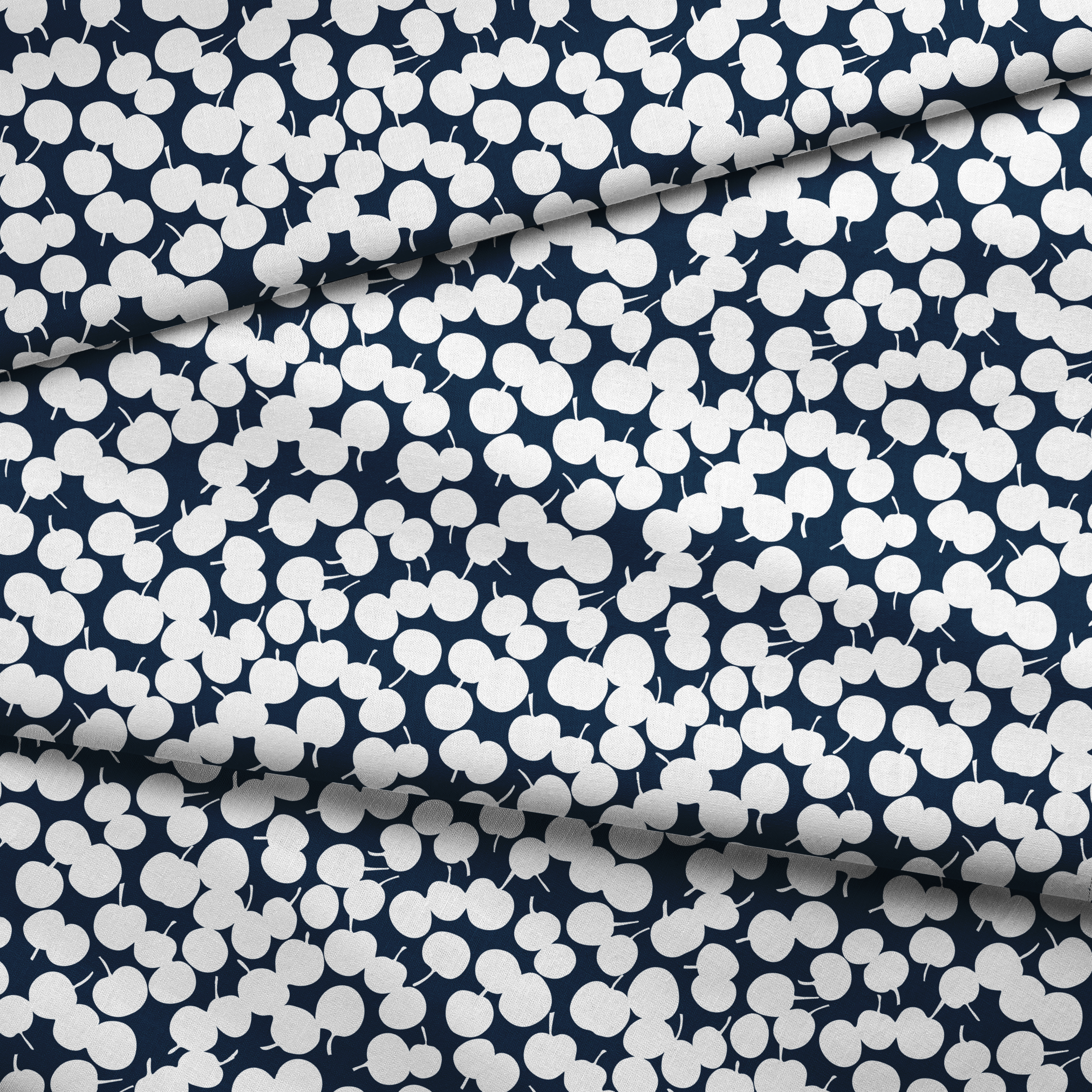 White cherry silhouettes scattered across a deep navy blue background in a playful pattern fabric fold mockup