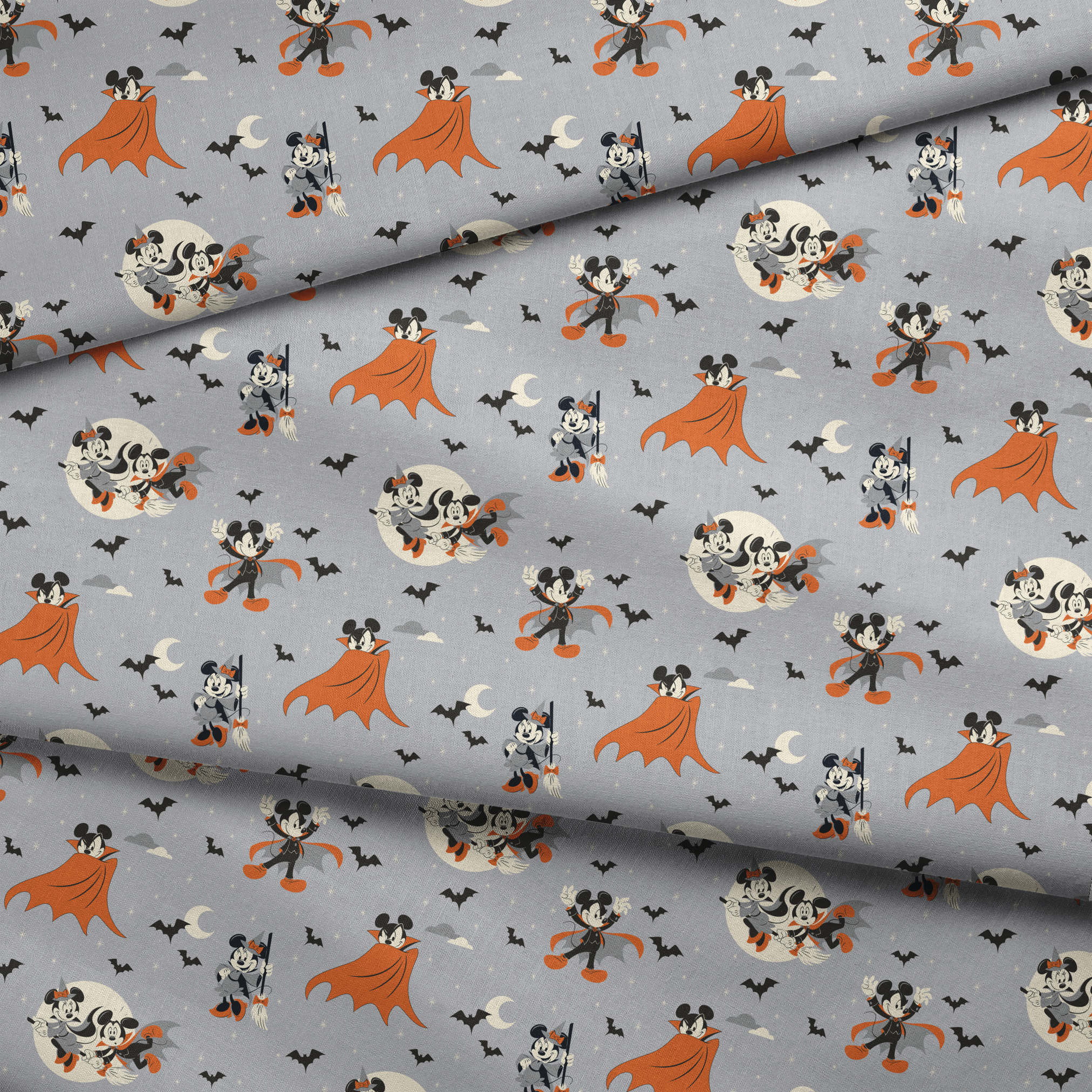 Mickey and Minnie Mouse in Halloween costumes on gray background with bats and moons, orange capes and spooky theme. fabric fold mockup