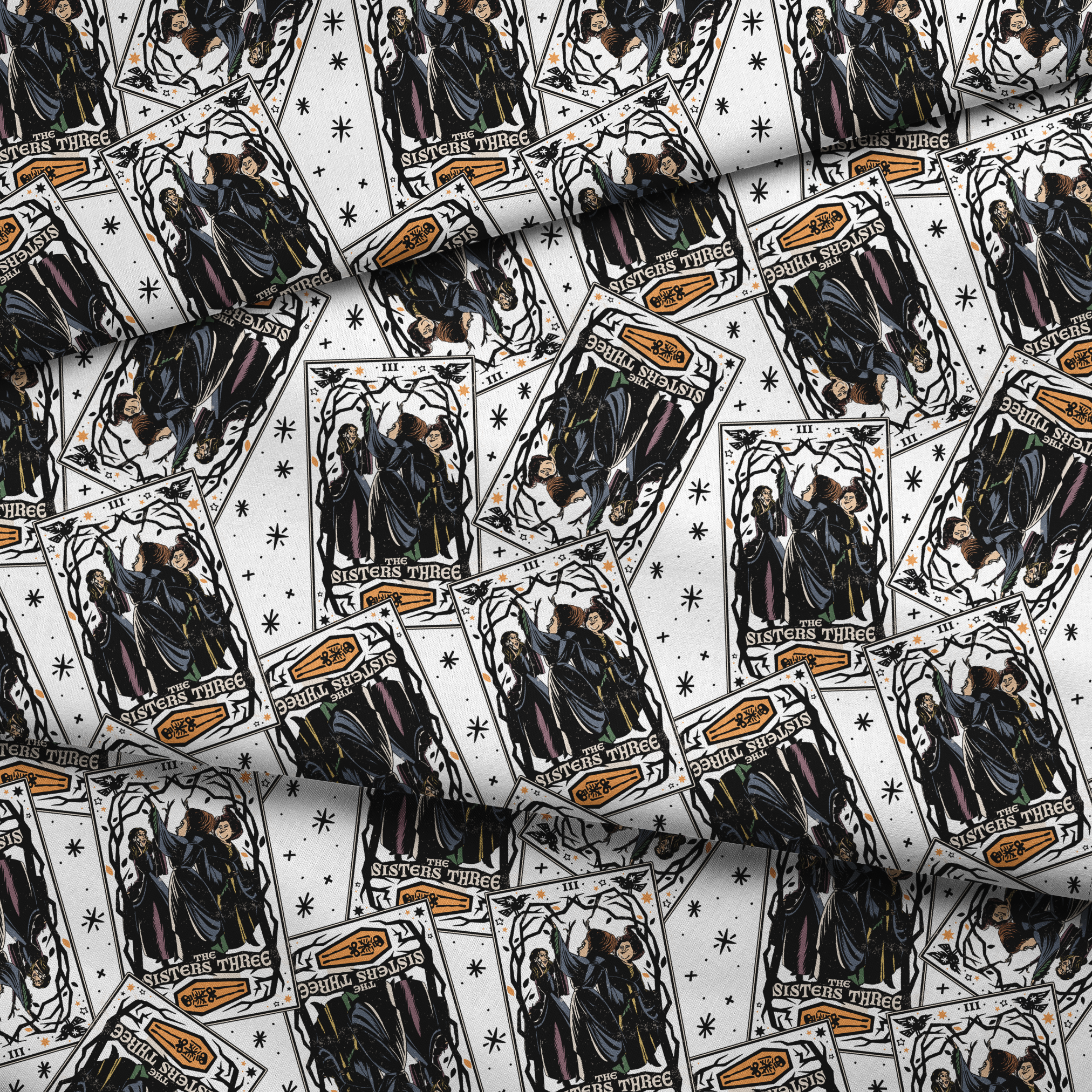 Scattered Hocus Pocus cards showing robed figures against white background with stars fabric fold mockup