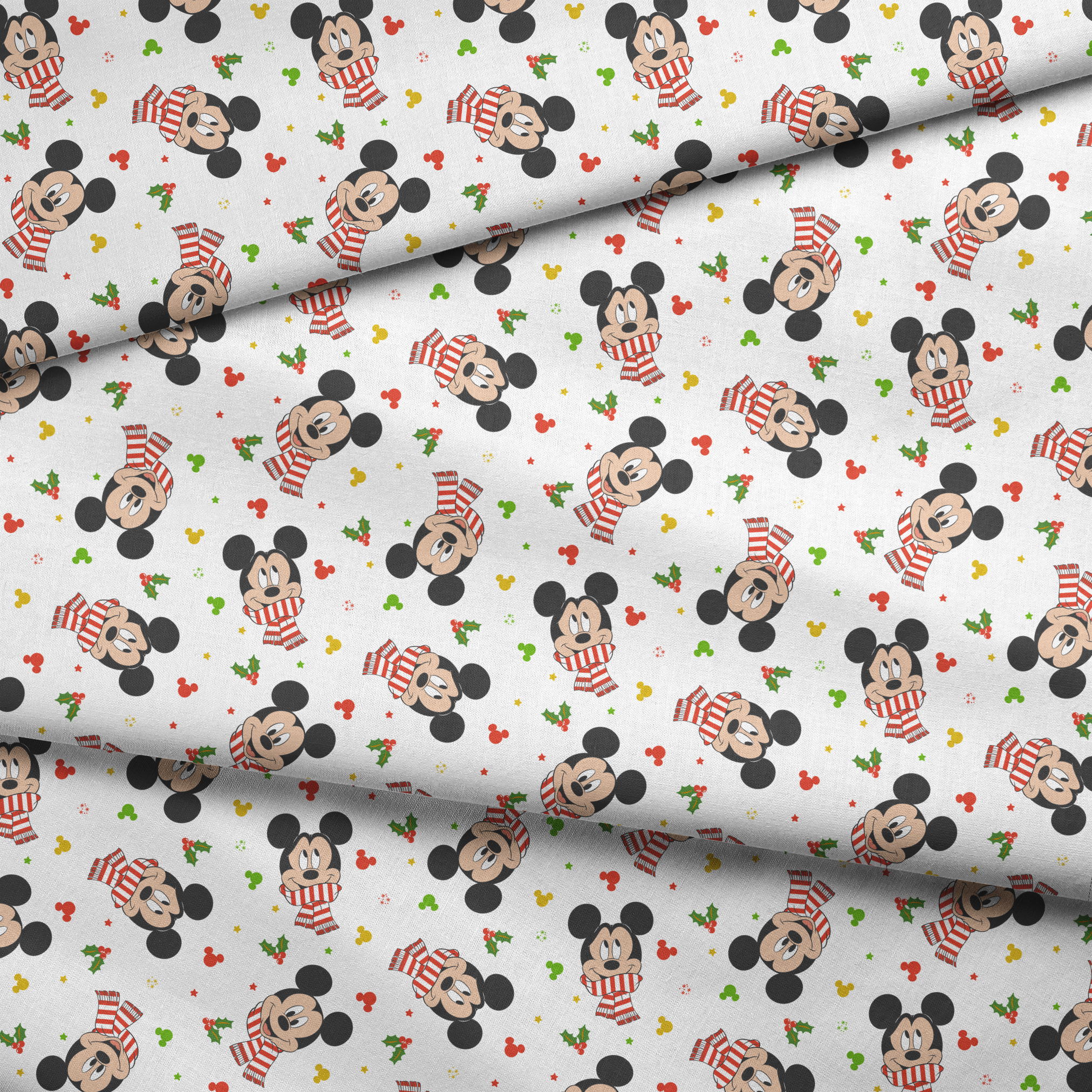 Mickey Mouse wearing red striped scarves, surrounded by holly and colorful icons on white background fabric fold mockup