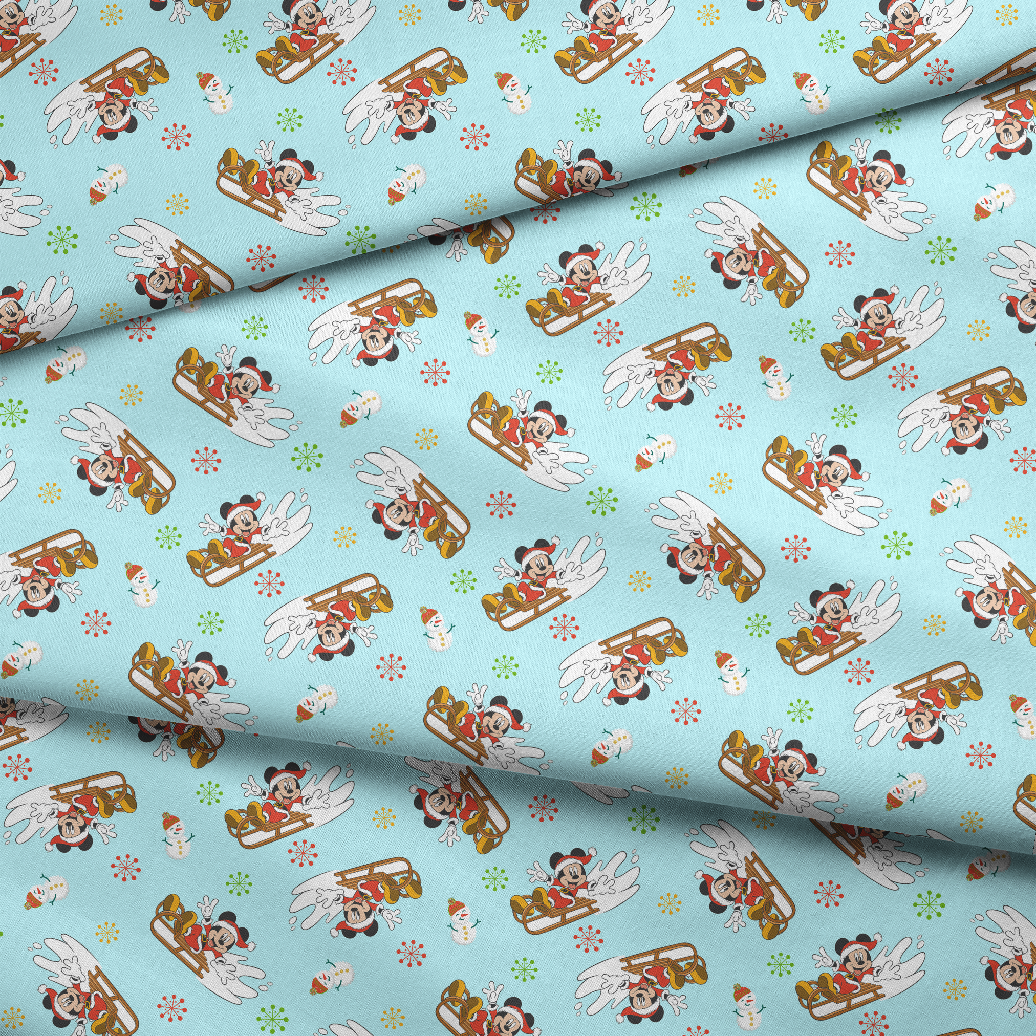 Christmas pattern with Mickey Mouse on sleds, snowmen, and colorful snowflakes on light blue background fabric fold mockup