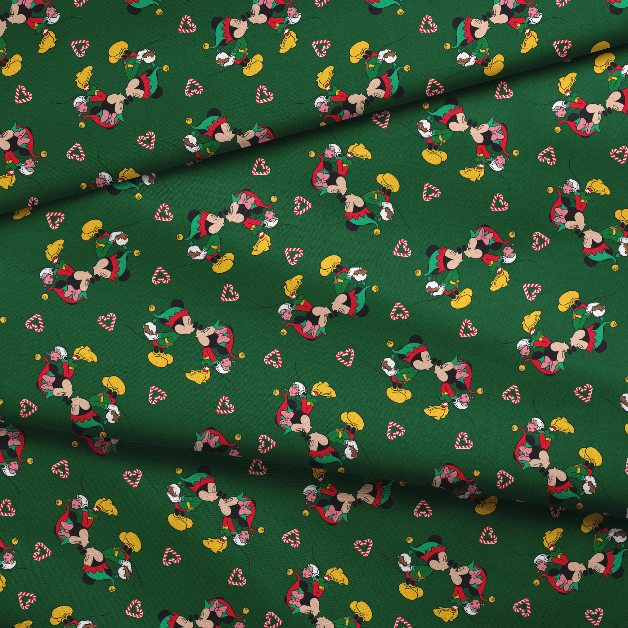 Festive Mickey Mouse pattern with candy canes on green background fabric fold mockup