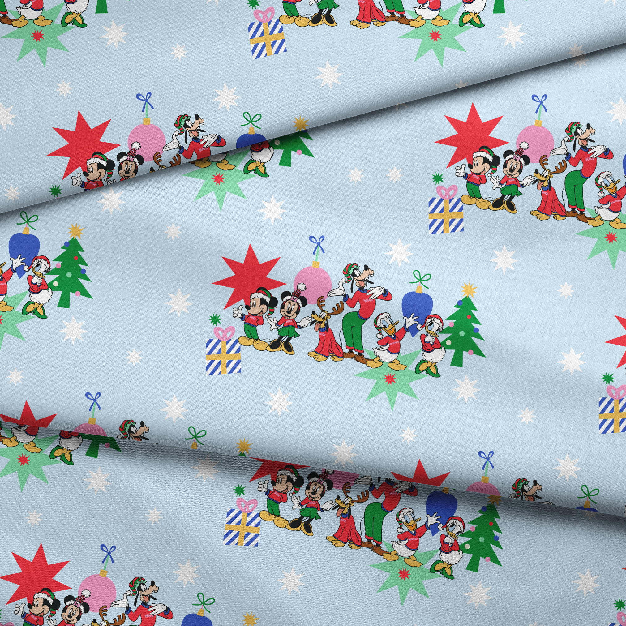 Cartoon Disney characters in festive poses with Christmas trees, ornaments, and stars on light blue snowy background fabric fold mockup