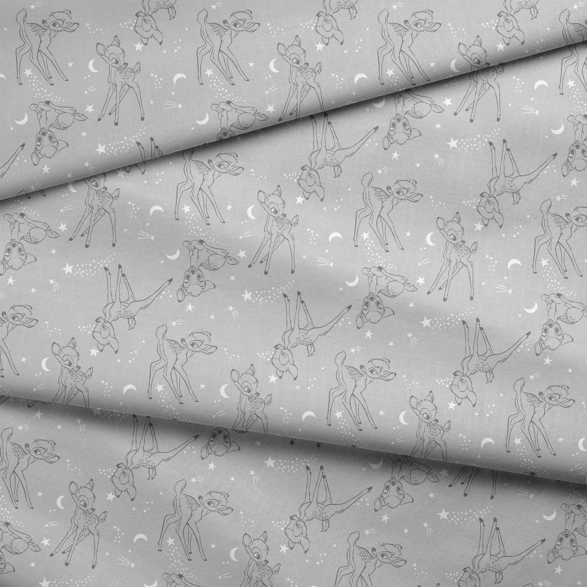 Line art illustrations of Disney’s Bambi surrounded by stars, moons, and stardust trails on a soft gray background in a scattered repeat. fabric fold mockup