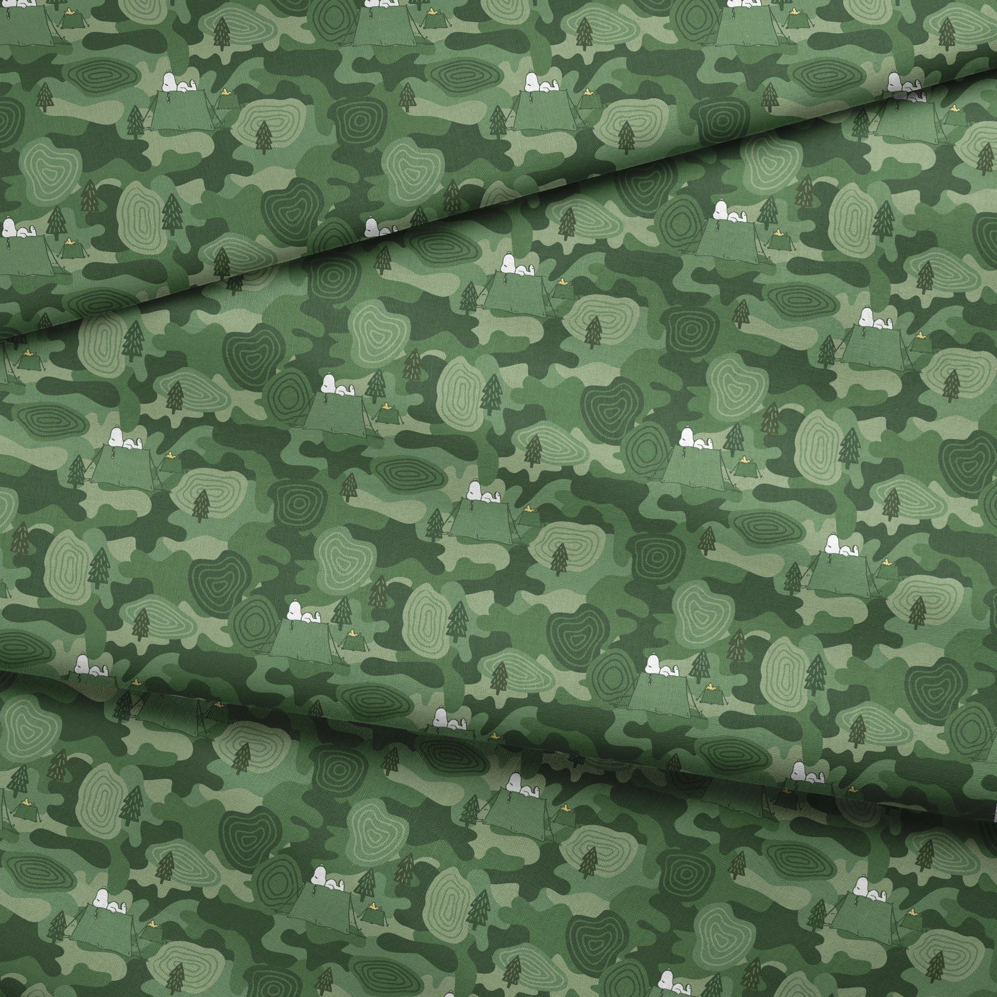 Snoopy camping scene with tents and trees on a green camouflage pattern background fabric fold mockup