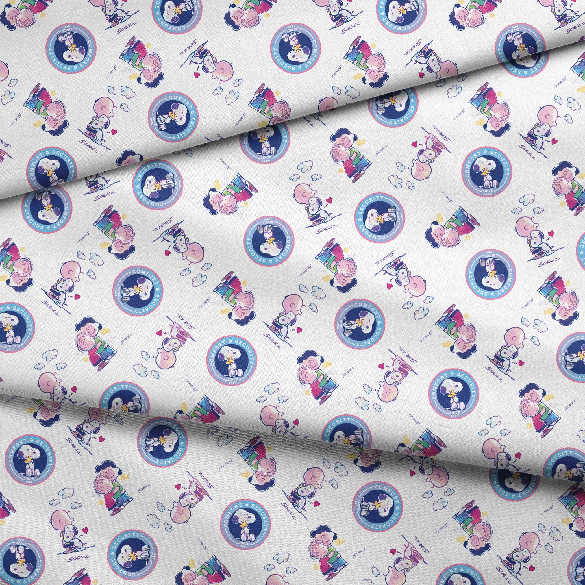 Peanuts cartoon pattern with Snoopy in blue circles and Charlie Brown with books on white background fabric fold mockup