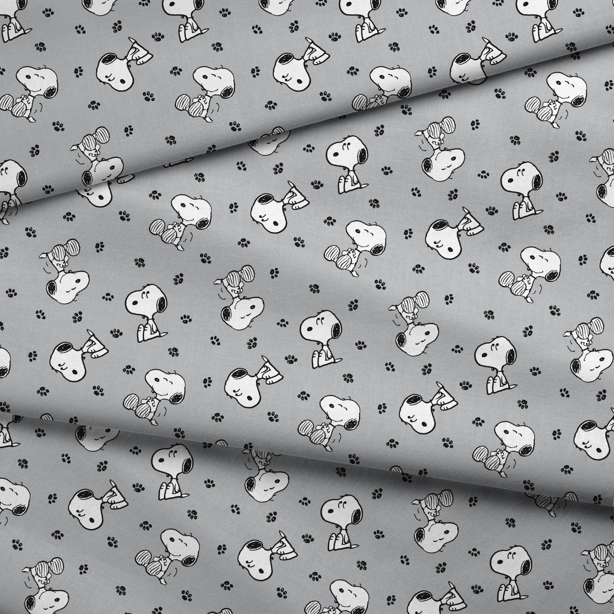 Snoopy with black ears on gray background with paw prints, in various poses fabric fold mockup