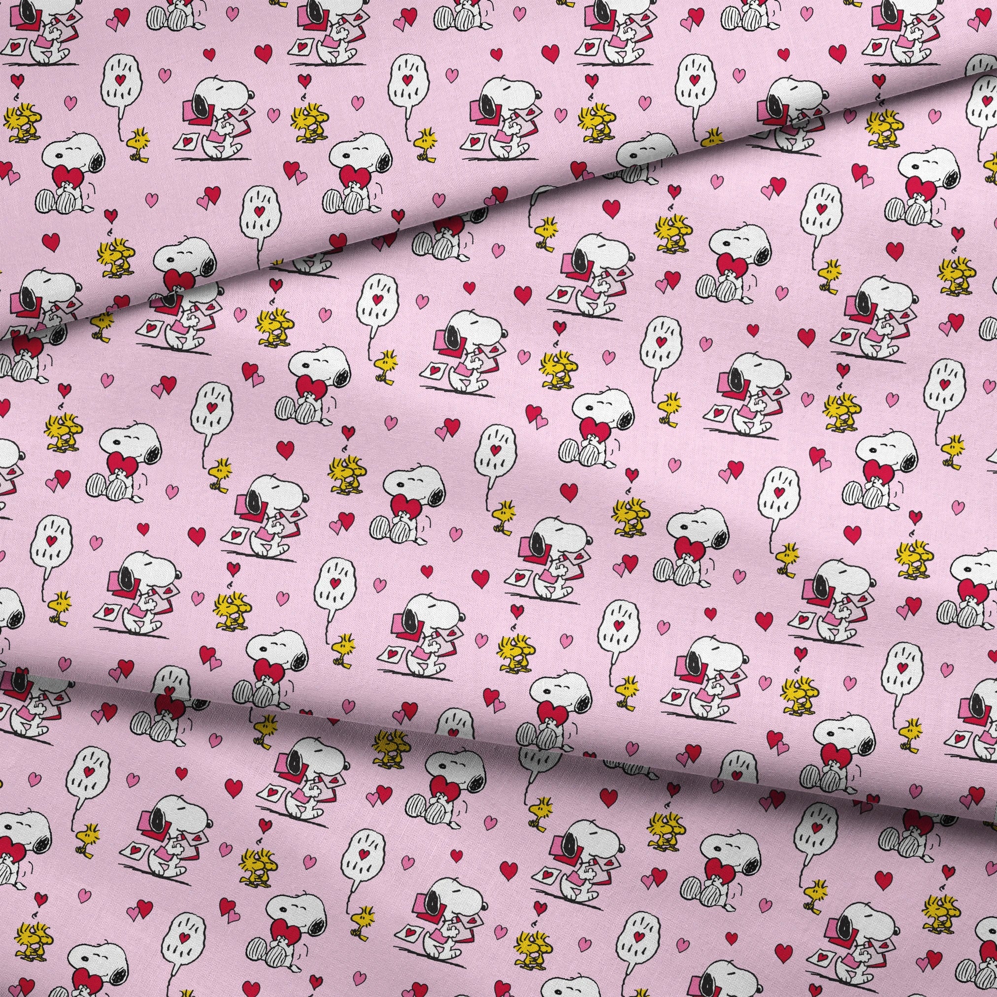 Valentine's pattern with Snoopy, Woodstock, and hearts on pink background, featuring love letters and speech bubbles. fabric fold mockup
