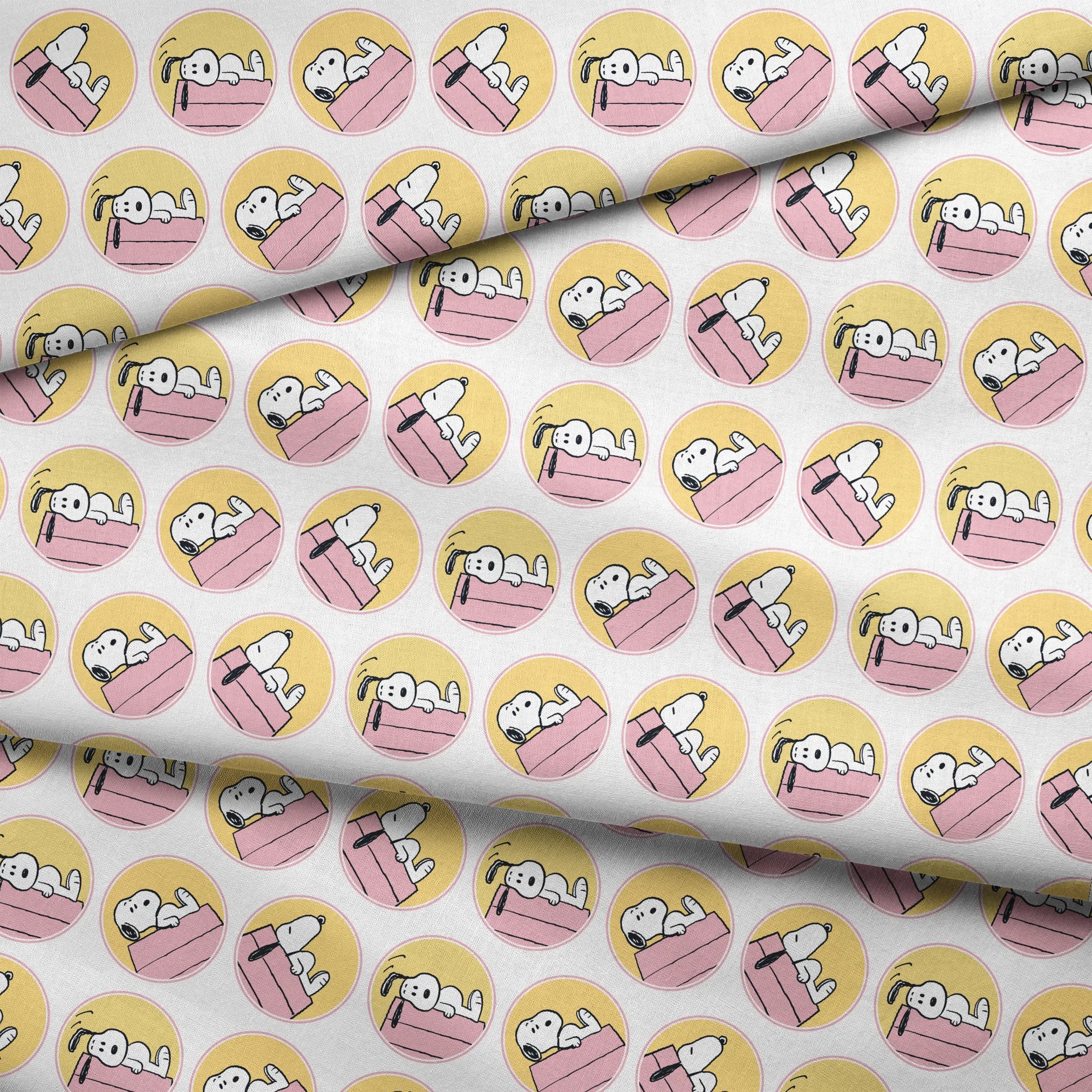 Snoopy lounging on pink doghouse roof in various poses, arranged in circular yellow frames fabric fold mockup