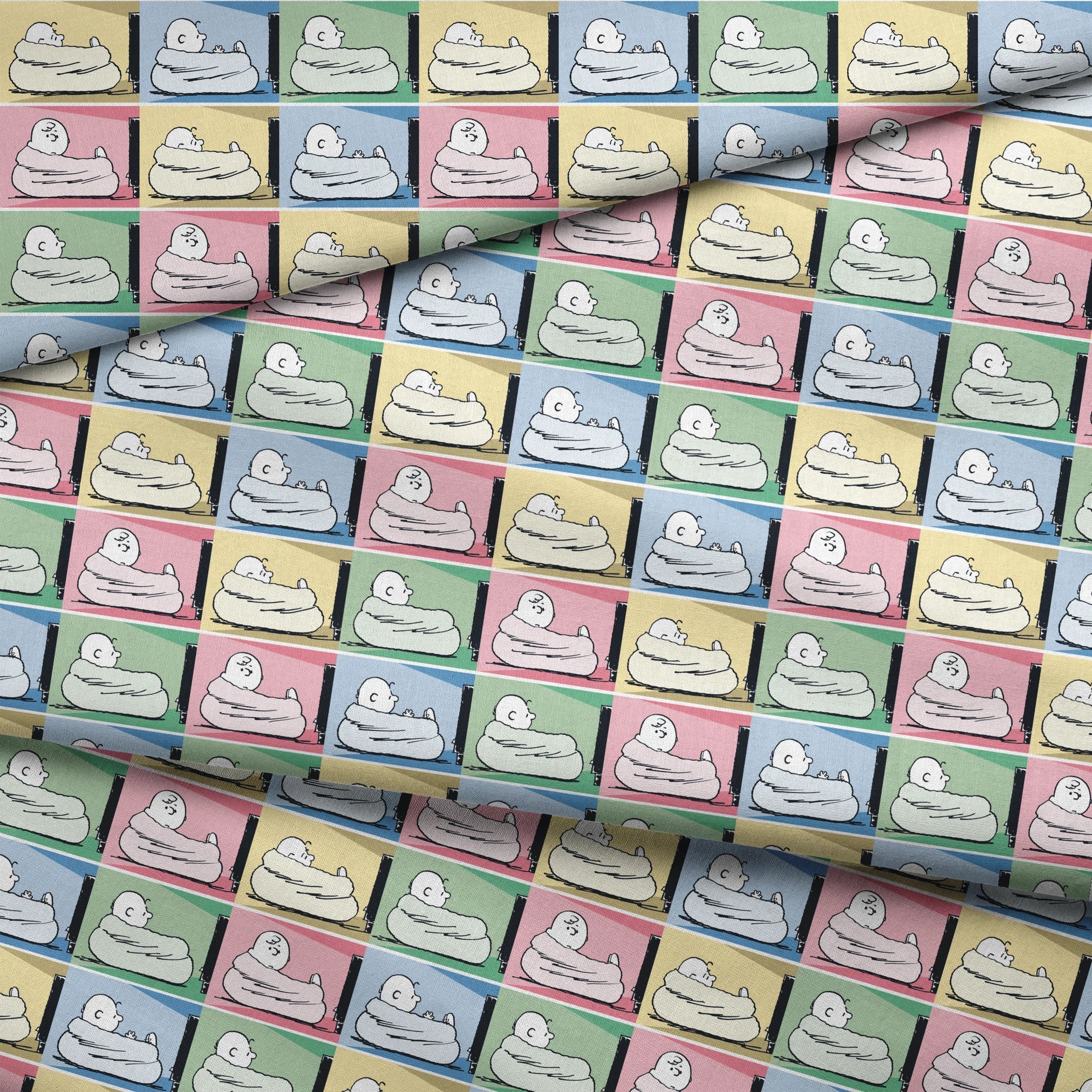 Charlie Brown resting on a white bed/nest in a grid of 12 colorful panels with pastel backgrounds. fabric fold mockup
