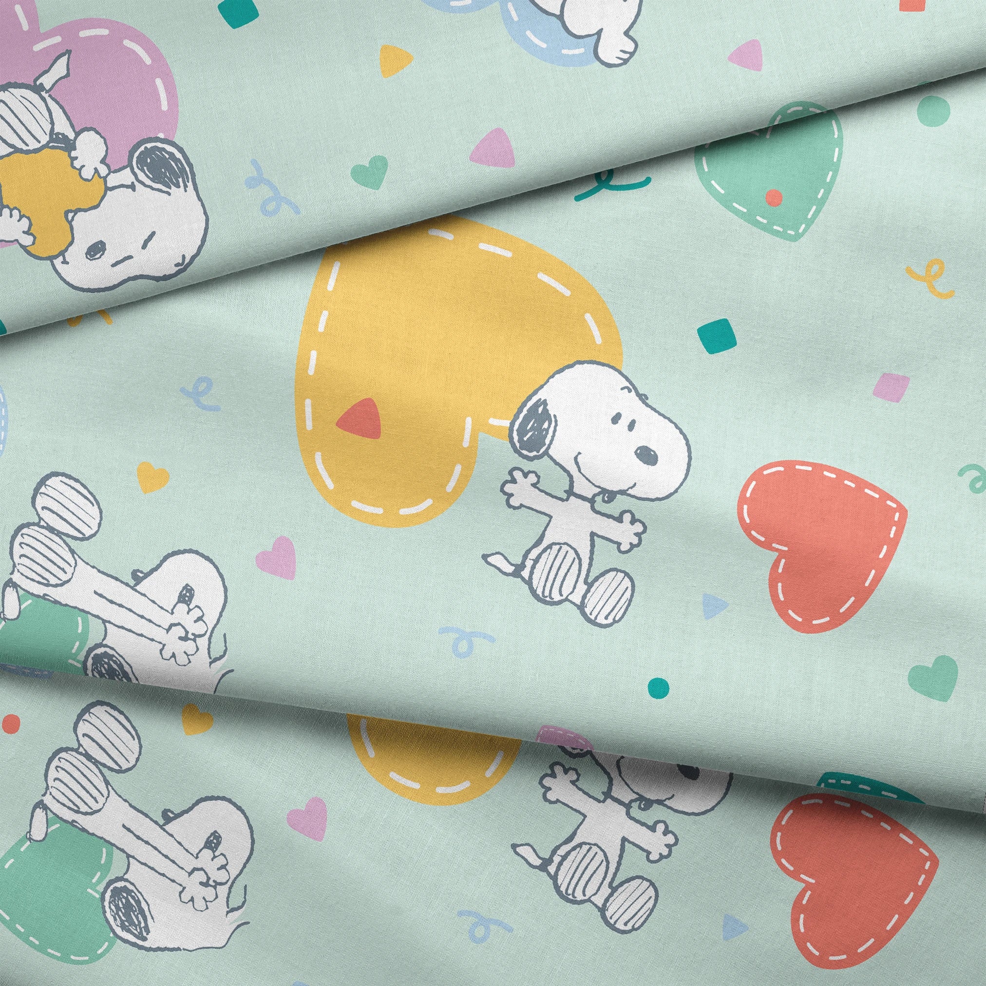 Cartoon Snoopy pattern with colorful hearts on mint green background, featuring different Snoopy poses fabric fold mockup
