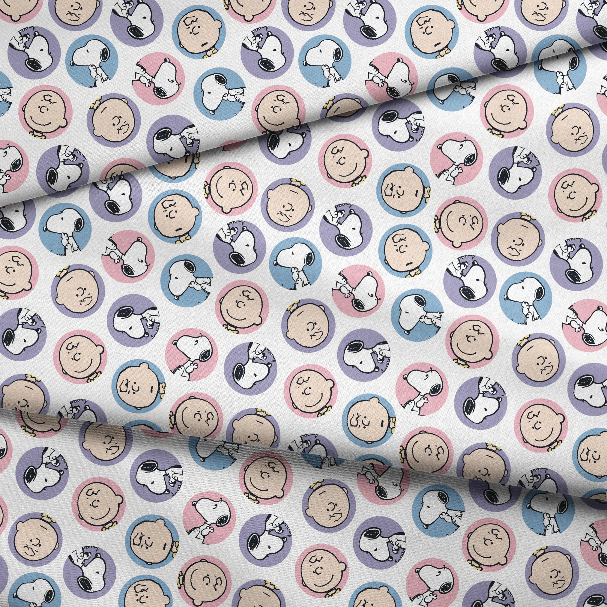 Peanuts cartoon pattern with Charlie Brown and Snoopy circular portraits in pink, blue and purple fabric fold mockup