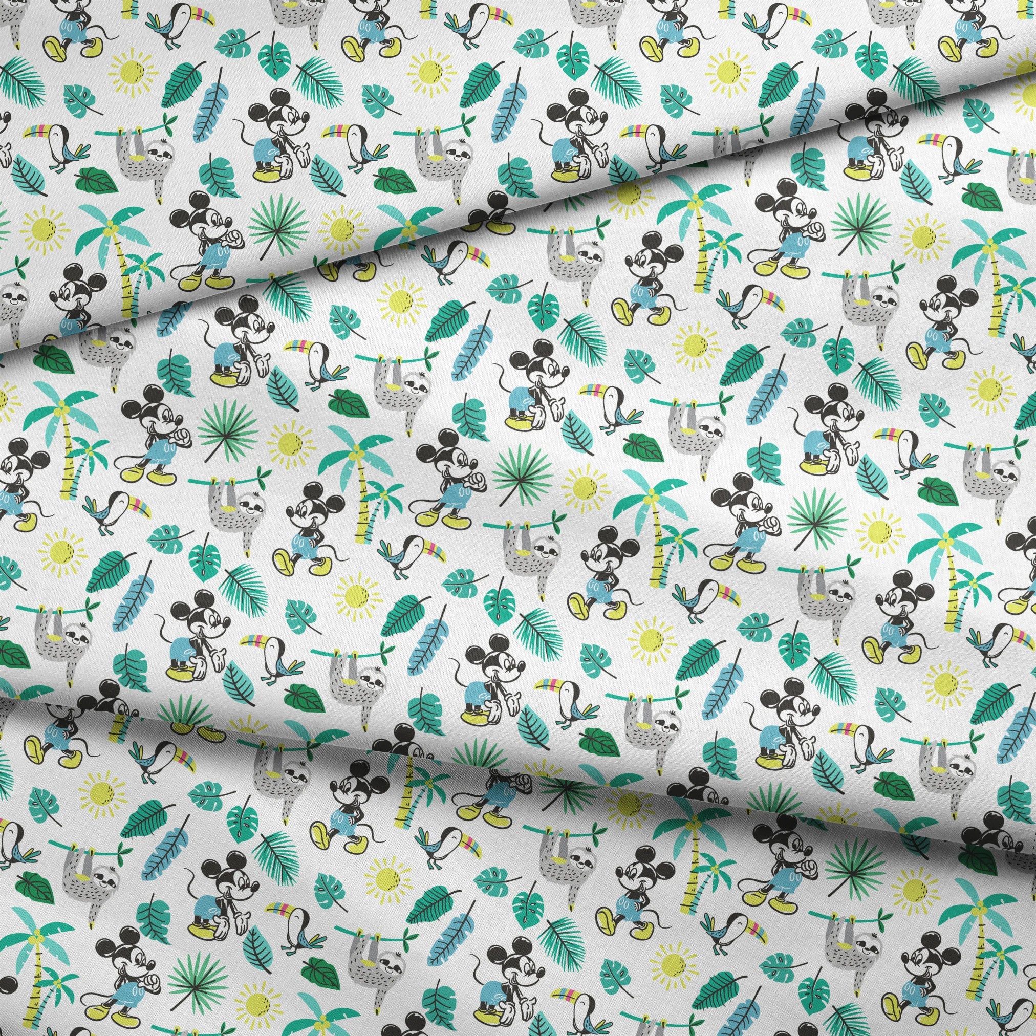 Tropical pattern with cartoon characters, sloths, toucans, palm leaves, and suns on white background fabric fold mockup