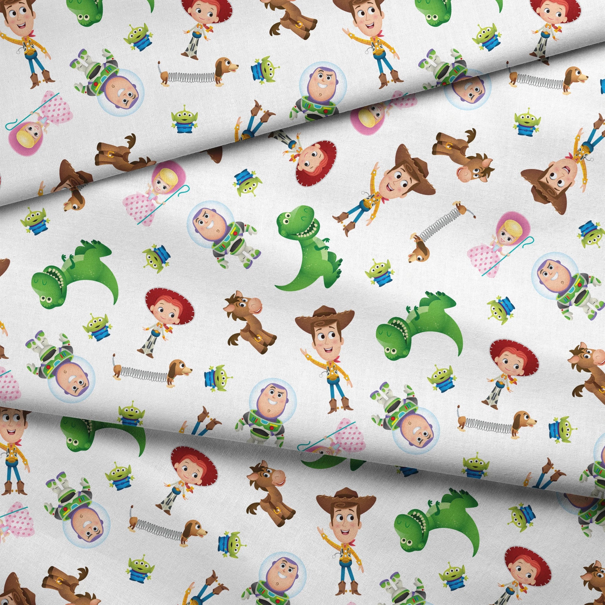 Toy Story character pattern with Woody, Buzz, Jessie, Rex, Slinky Dog and aliens on white background fabric fold mockup