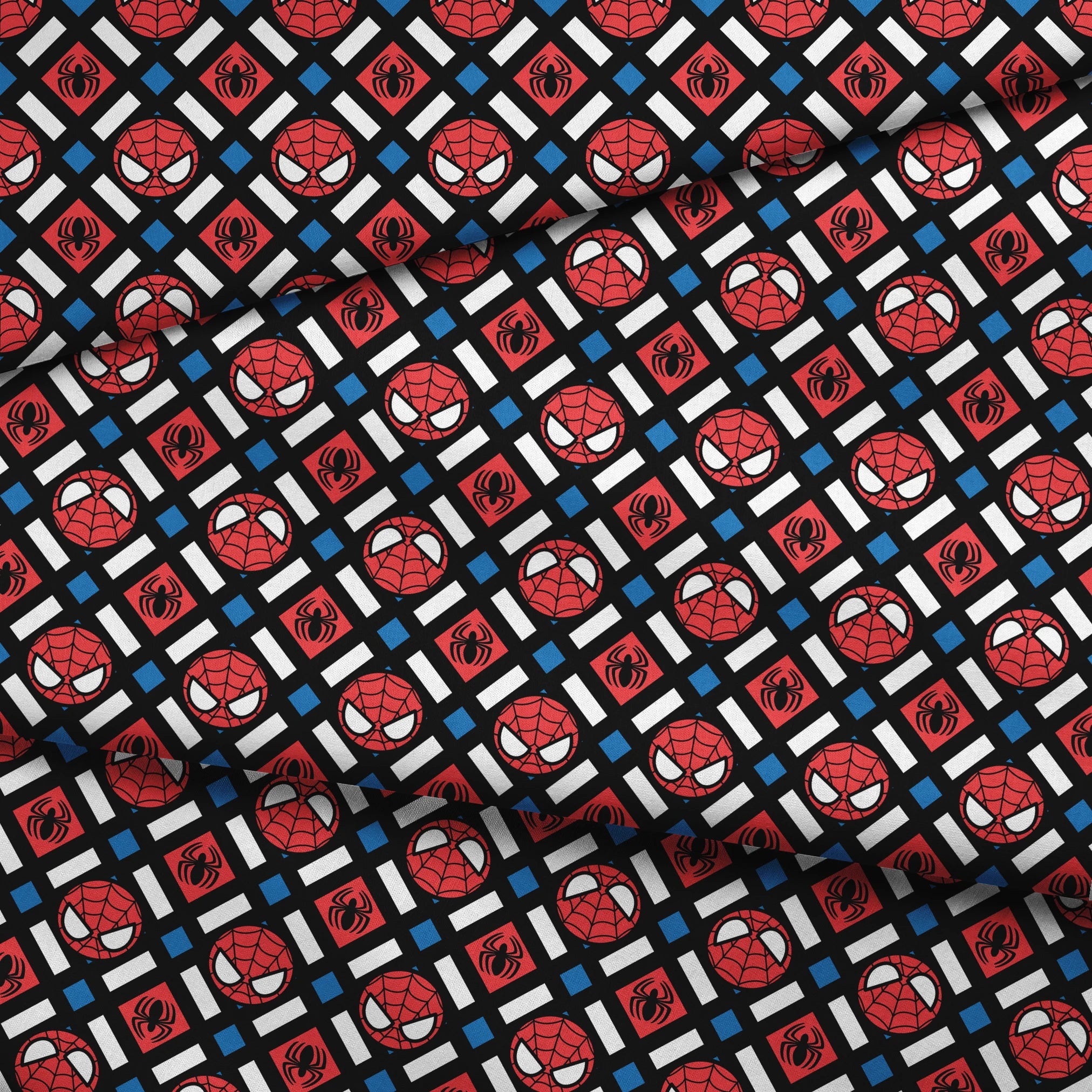 Spider-Man pattern with red masks, spider symbols, webs on black background with white X shapes and blue diamonds fabric fold mockup