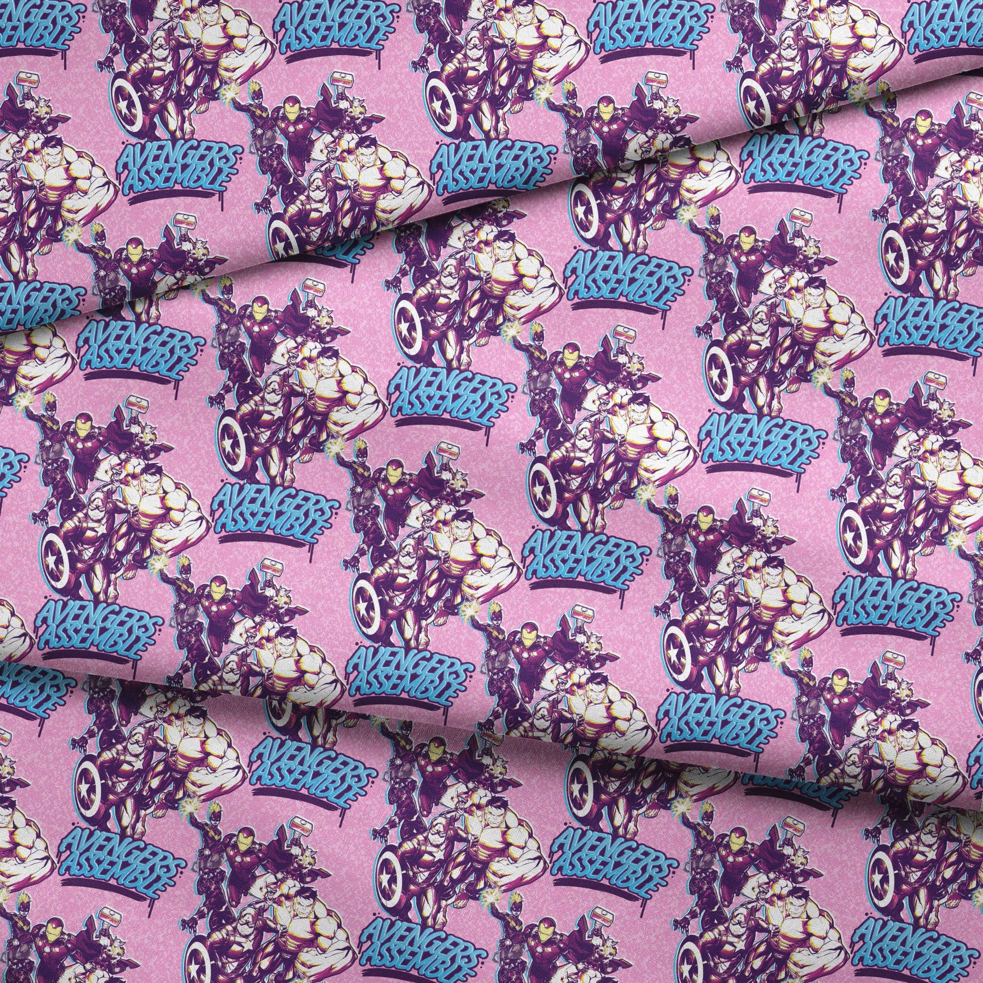Avengers comic book characters pattern on purple background with "Avengers Assemble" text fabric fold mockup